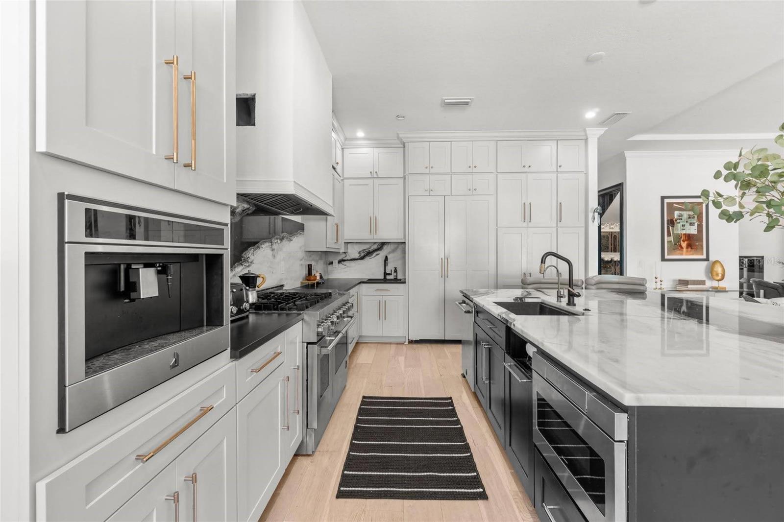 Kitchen w/ ample storage from floor to ceiling.