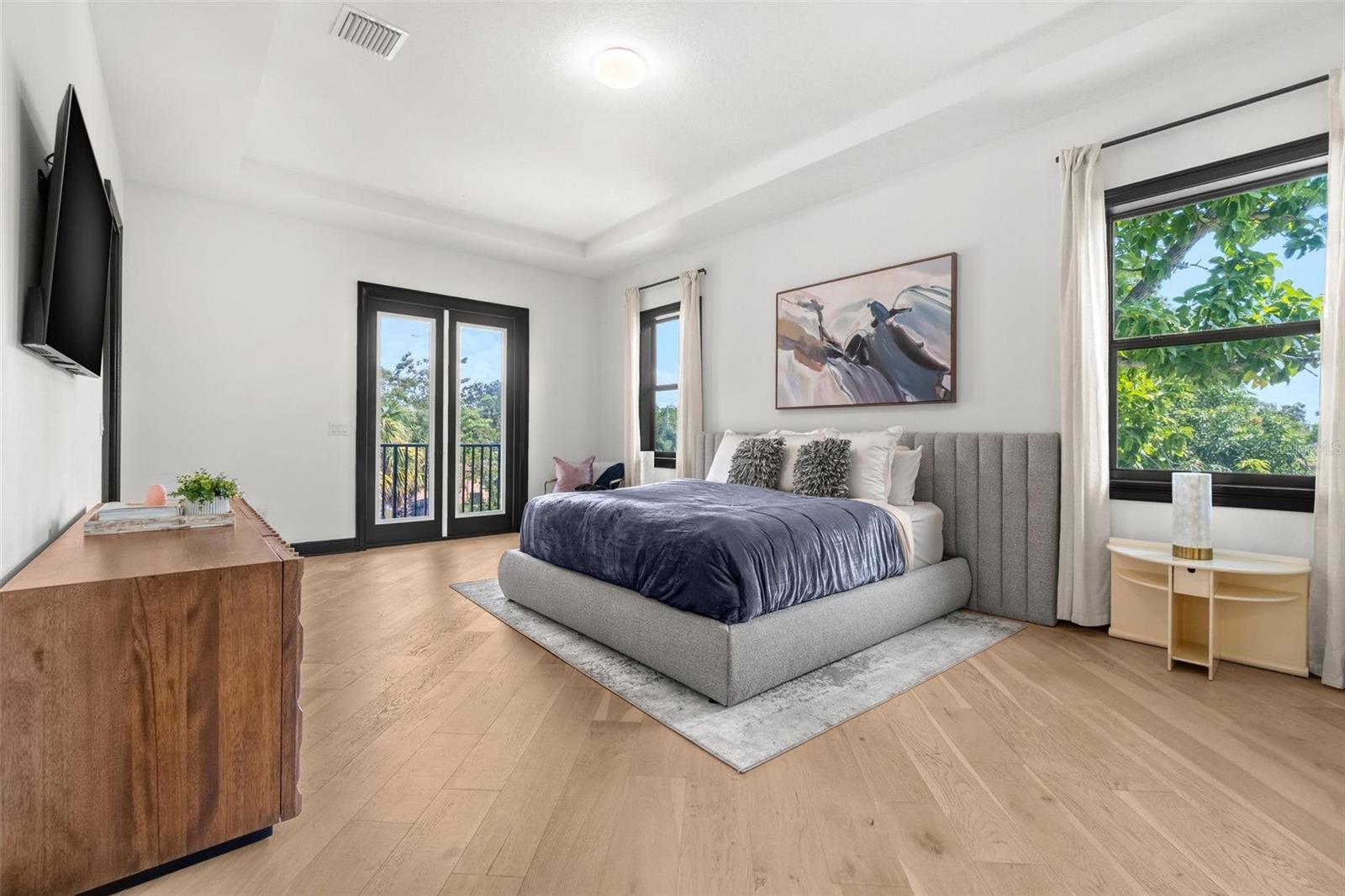 Primary with Tray Ceiling & Private Balcony.
