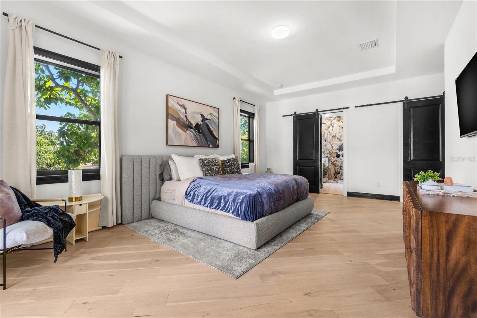 Primary with Tray Ceiling & Private Balcony.