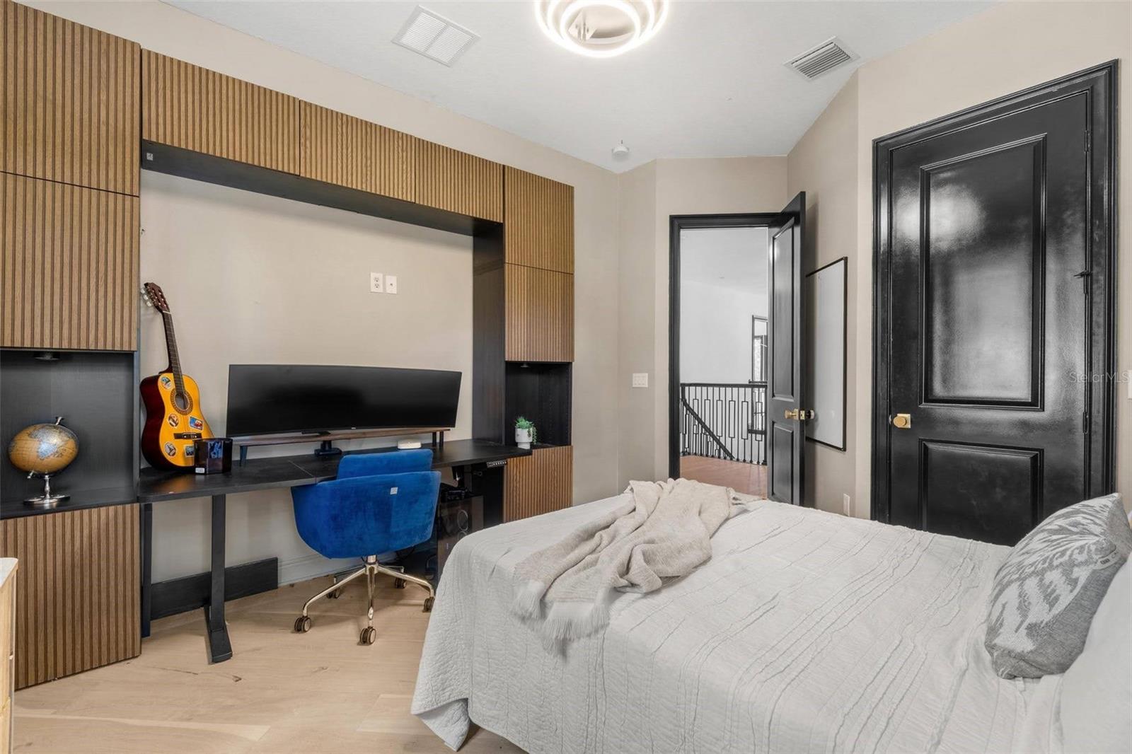 Bedroom 3 with built-in desk and walk-in closet.