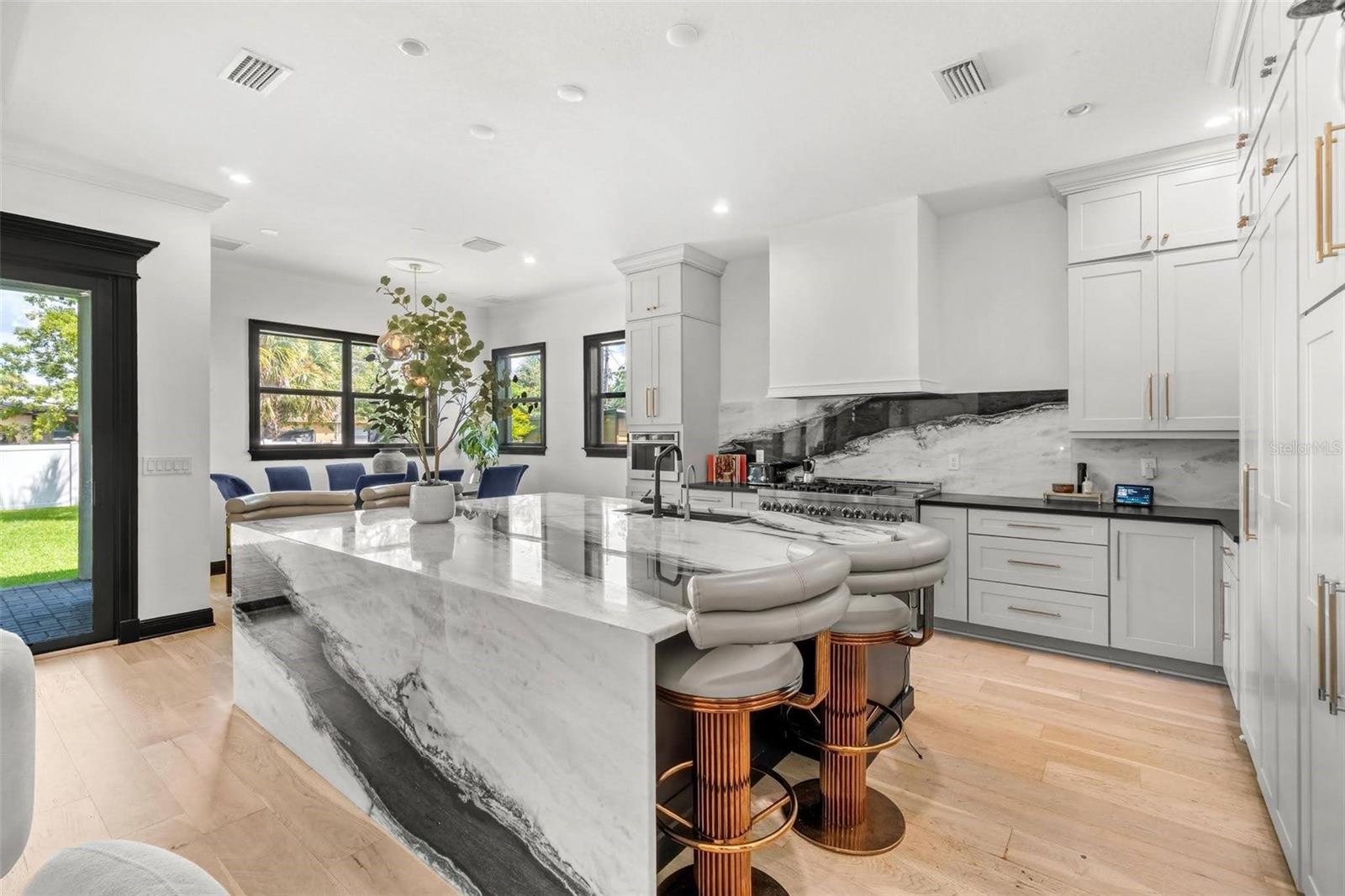 Panda Marble 9x7 Island with Seating.