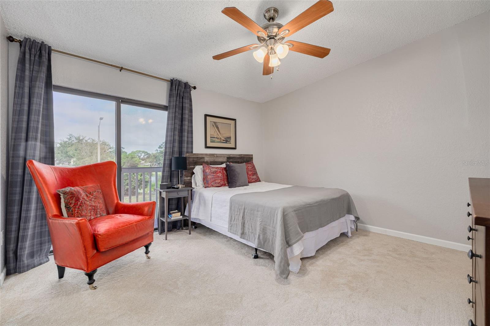 Primary Bedroom with View of Sliding Doors & Balcony