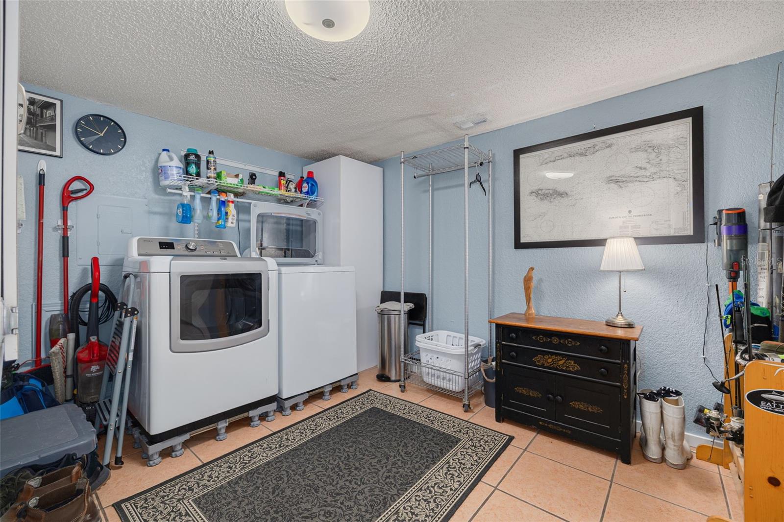 Spacious Laundry & Utility Room on Ground Level Leading to Garage