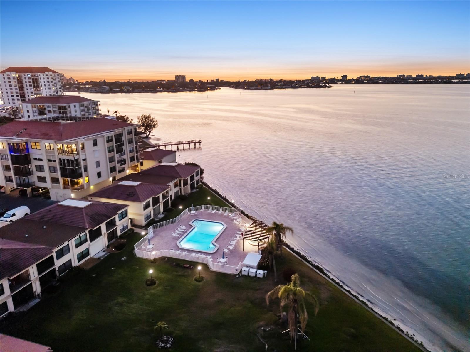 Sunset view of Community Pool and Boca Ciega Bay