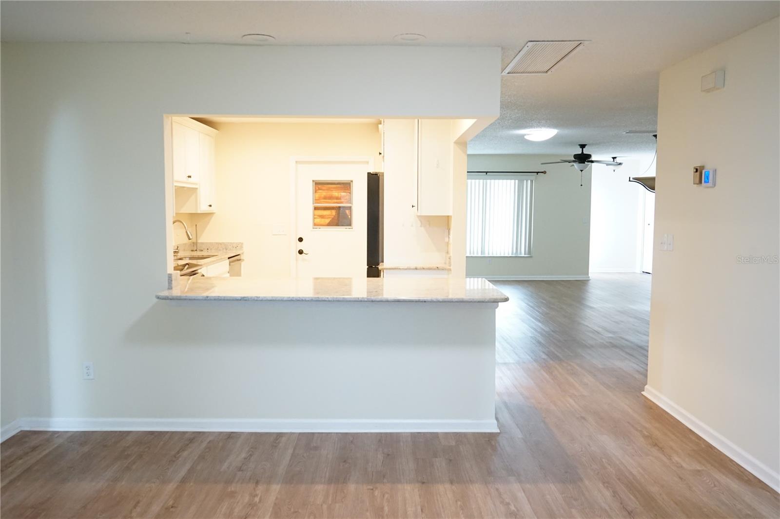 family room view to kitchen