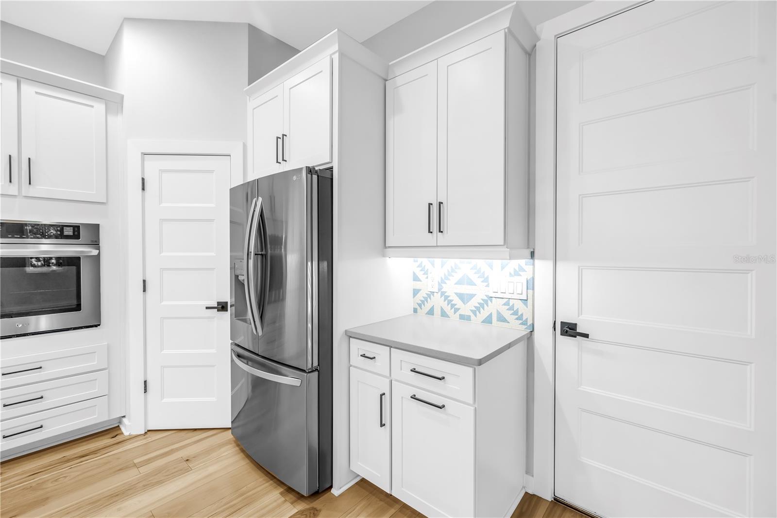 Door on right leads to garage, door on left is pantry.