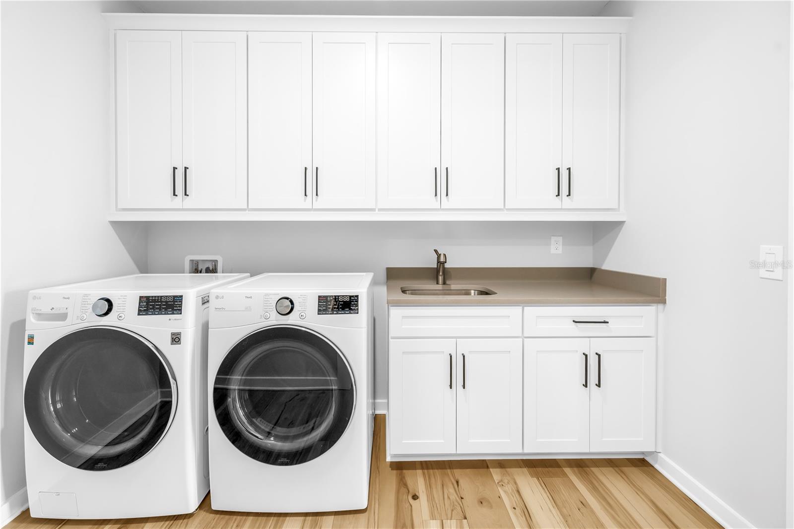 Laundry room is very spacious and has access to hallway AND primary walk-in closet.