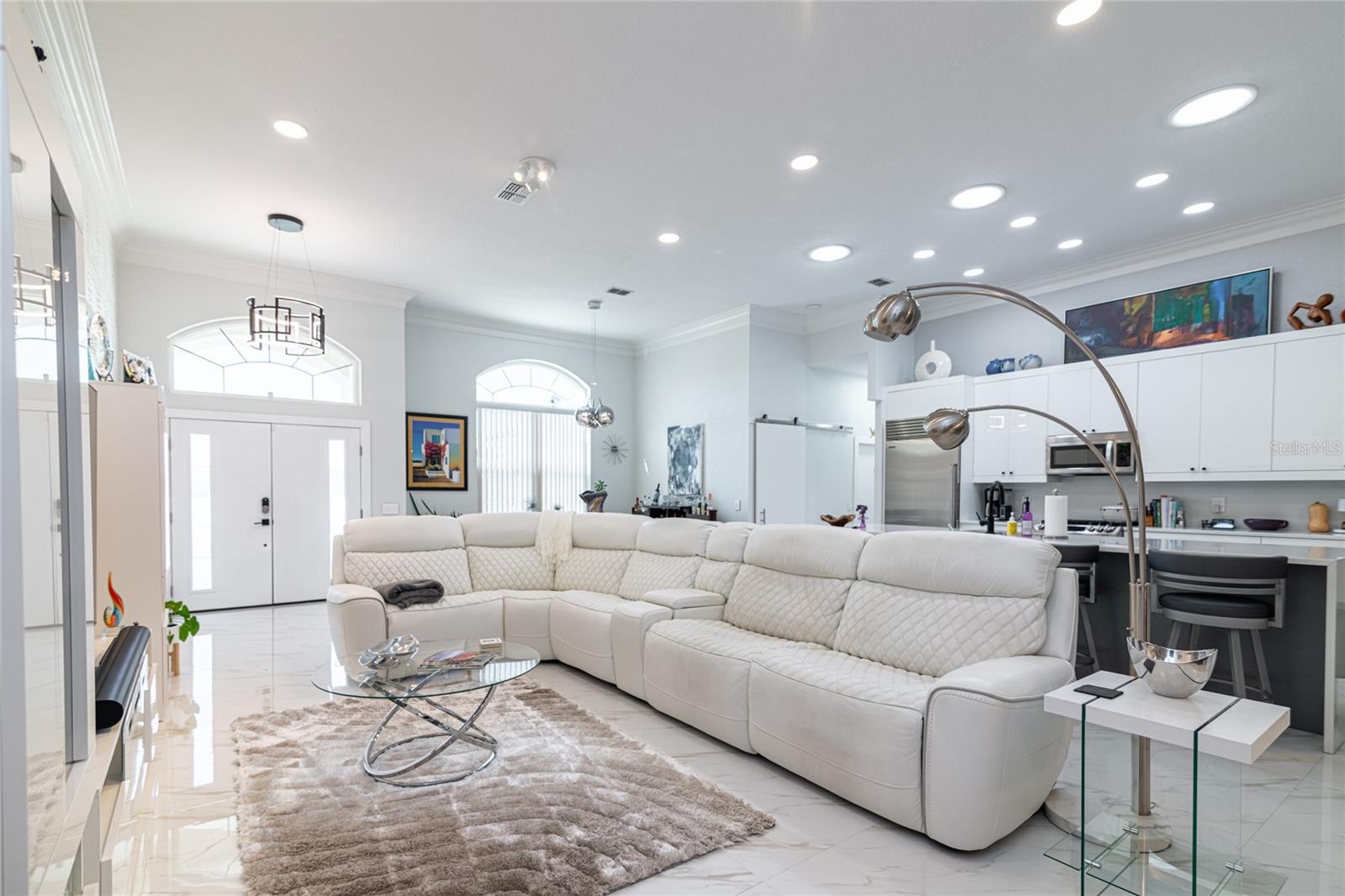 LIVING ROOM WITH KITCHEN BEHIND