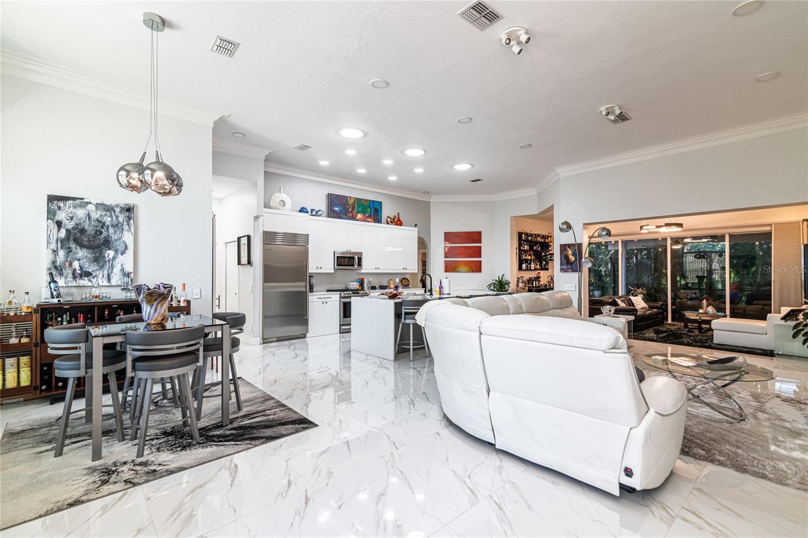 VIEW OF DINING AREA, KITCHEN AREA AND LIVING ROOM AREA