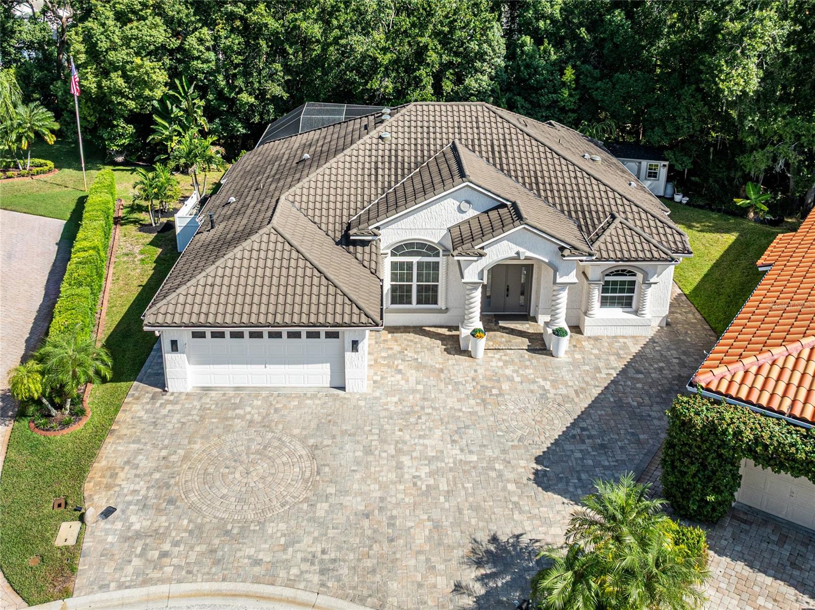 SPECTACULAR AERIAL FRONT VIEW OF PROPERTY WITH VIEW OF PAVERS