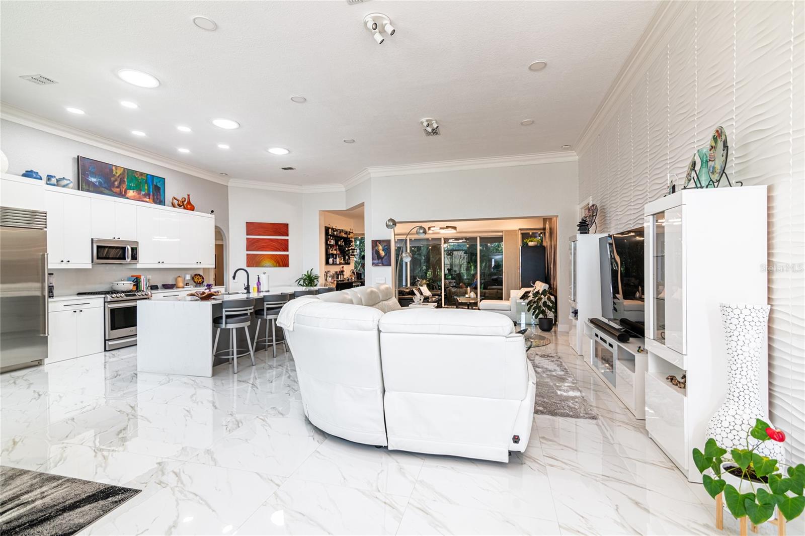 VIEW OF KITCHEN AREA AND LIVING ROOM AREA