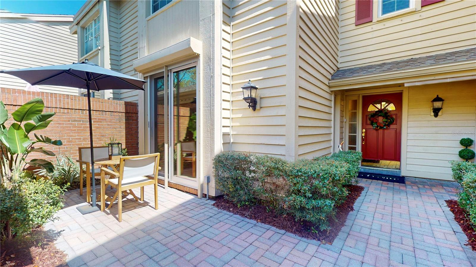 Front entrance with courtyard outside the kitchen/dinette sliders.