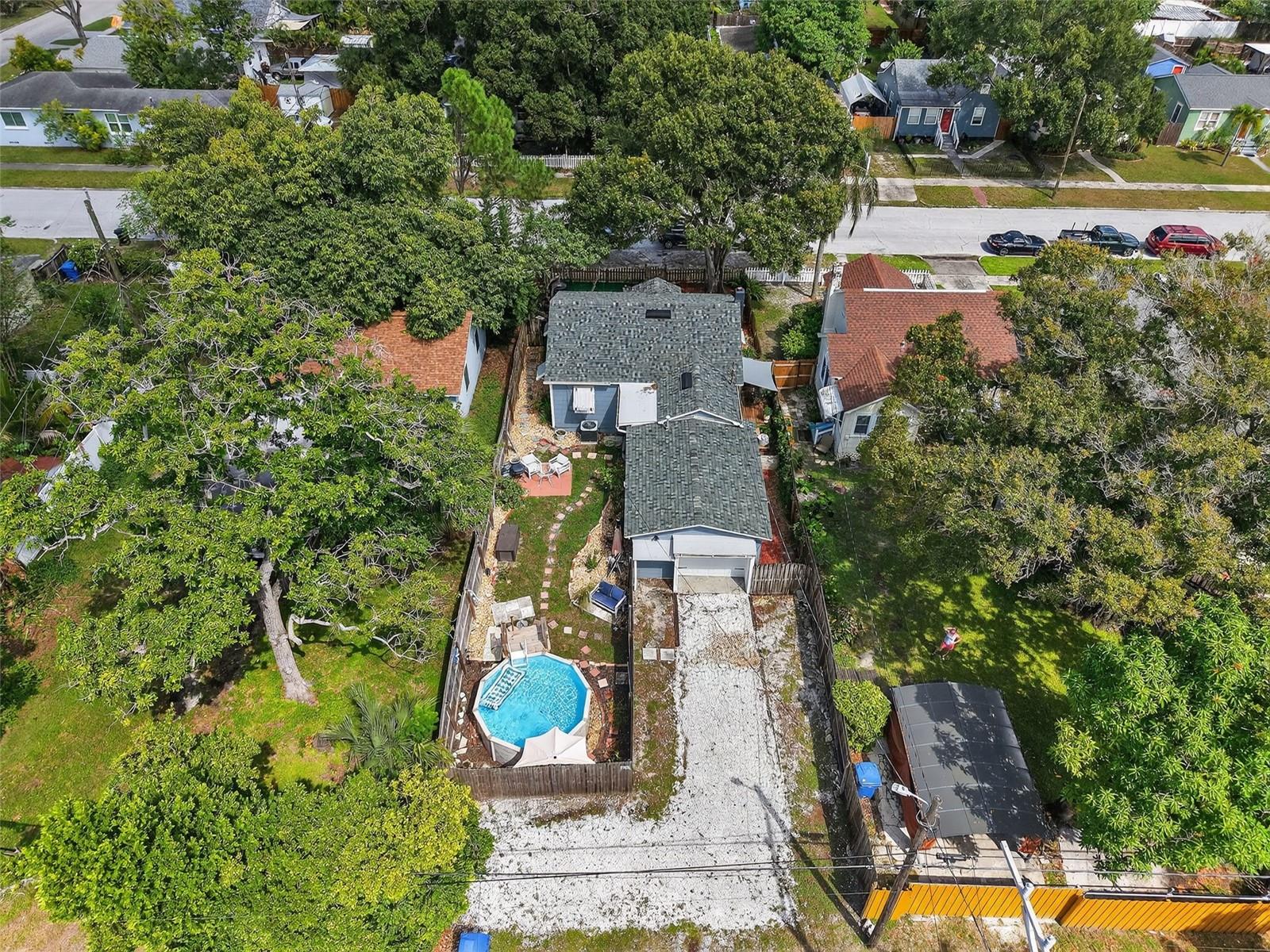 Aerial view of house with pool.