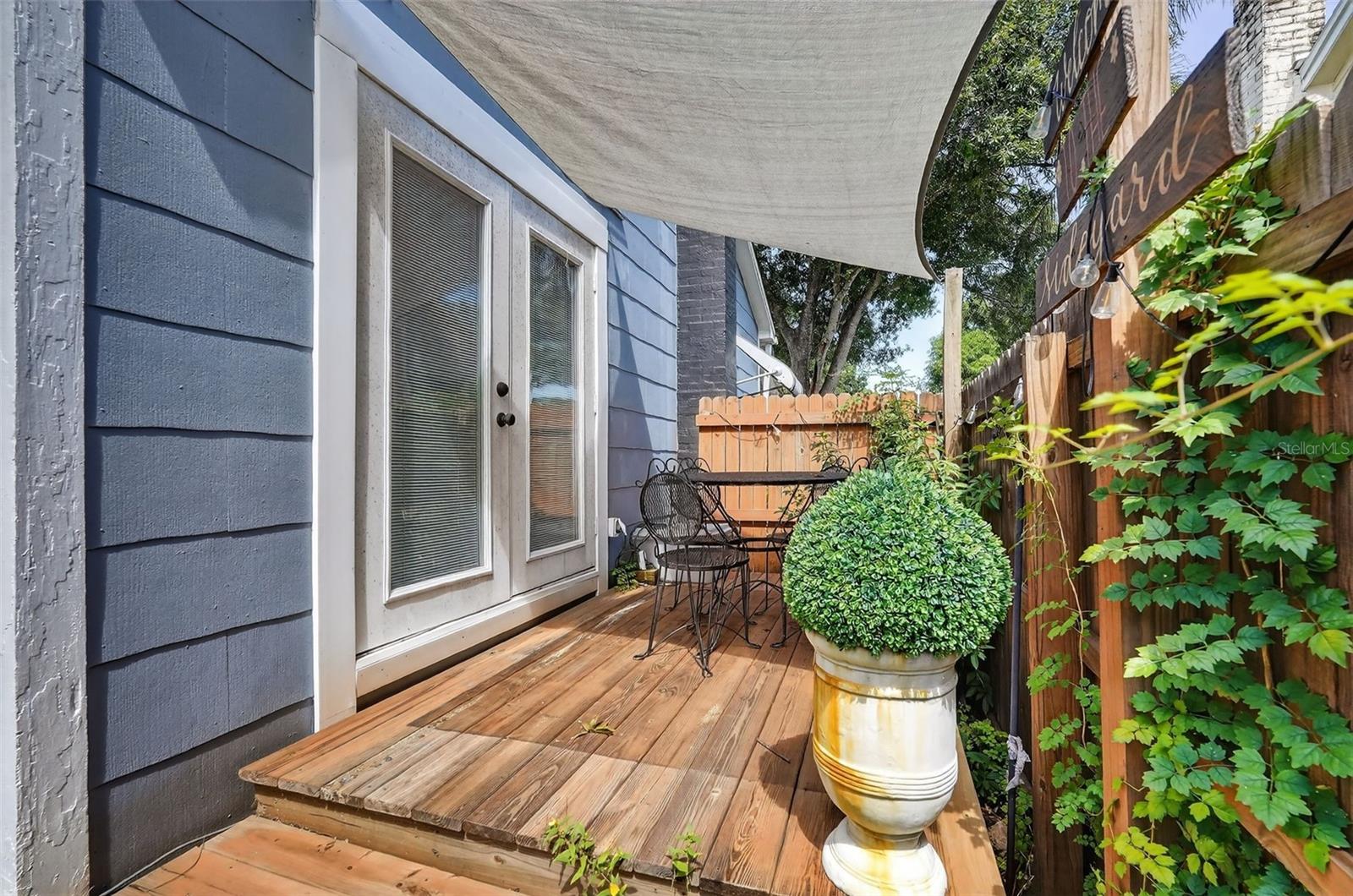 Charming sideyard accessible from kitchen.
