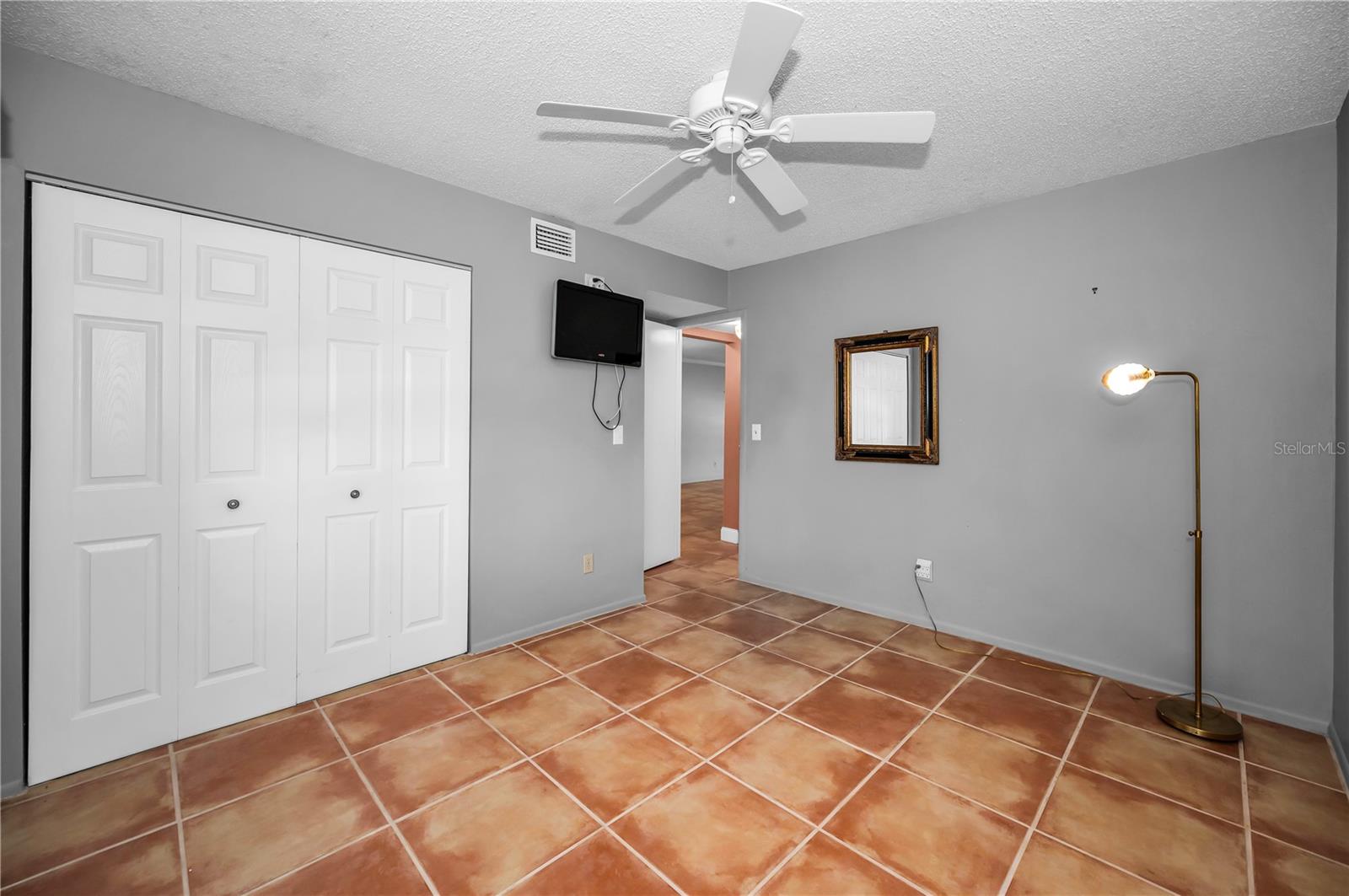 TV conveys with condo in 2nd bedroom