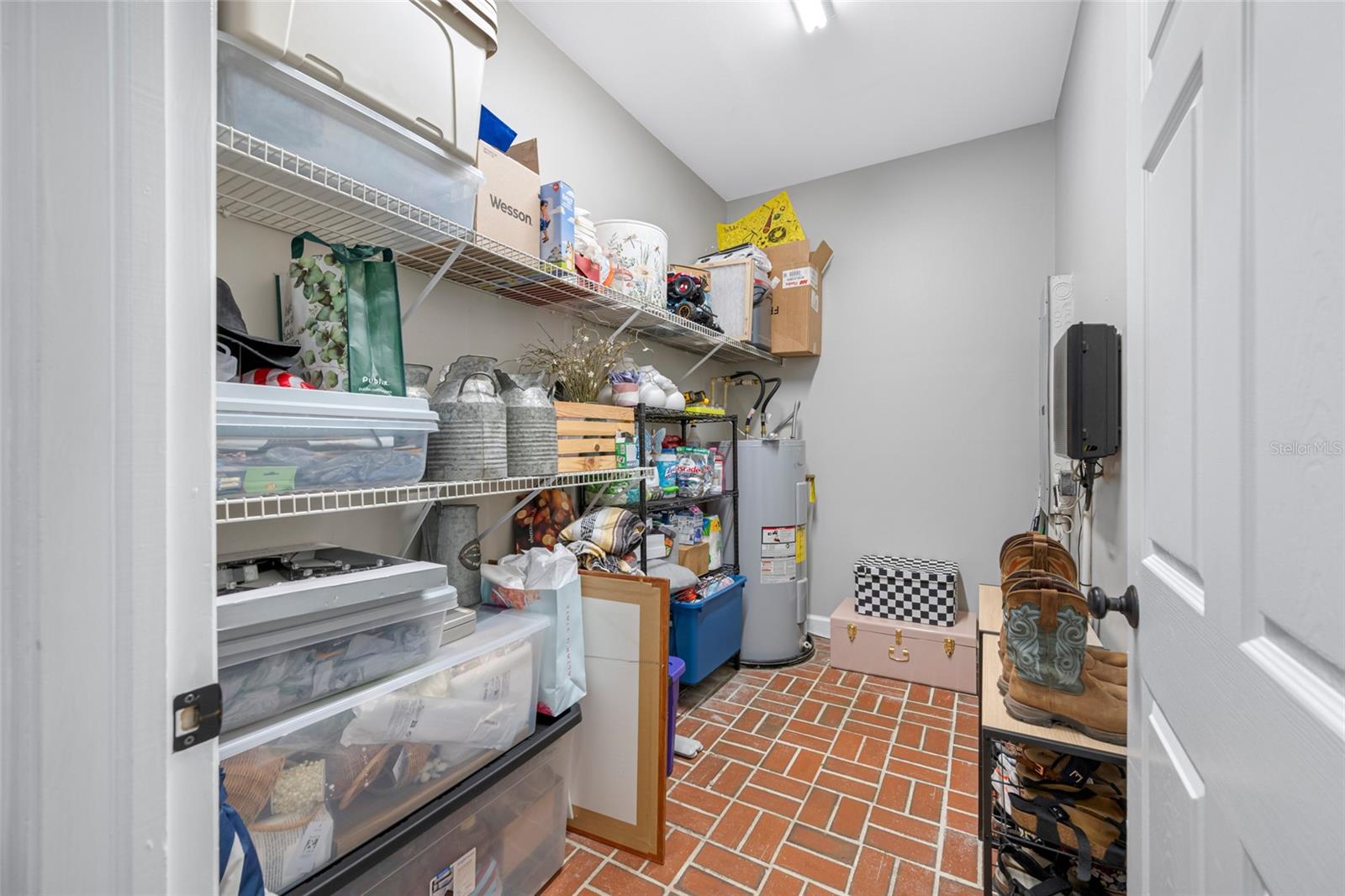 Spacious storage room off of mud room