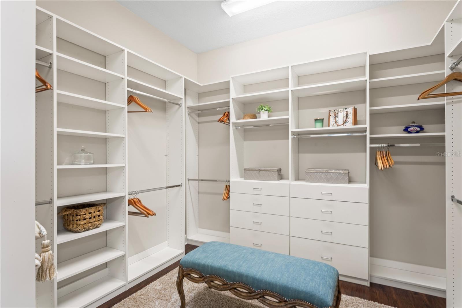 Primary walk-in closet with built-ins