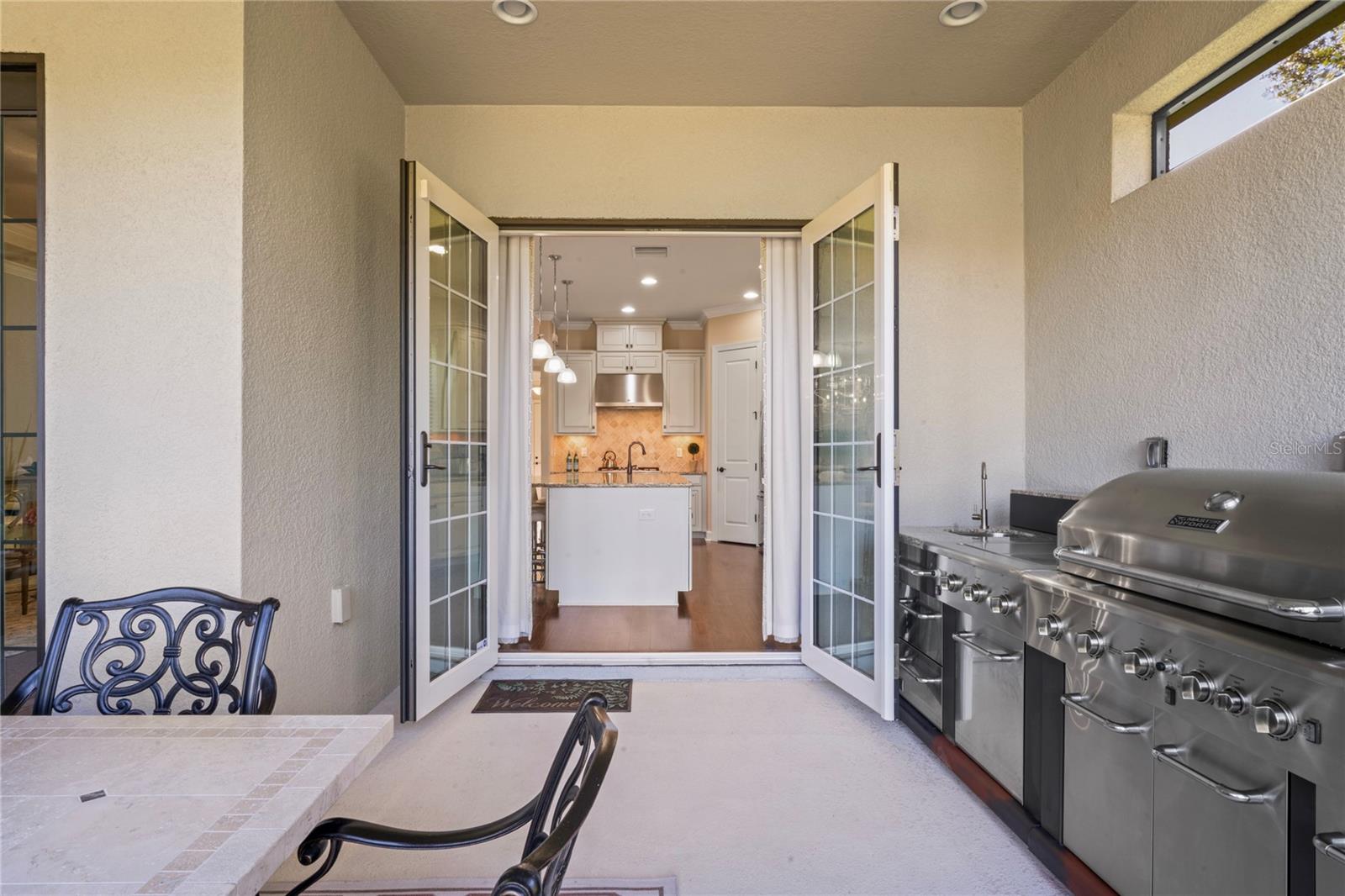 French doors open to kitchen
