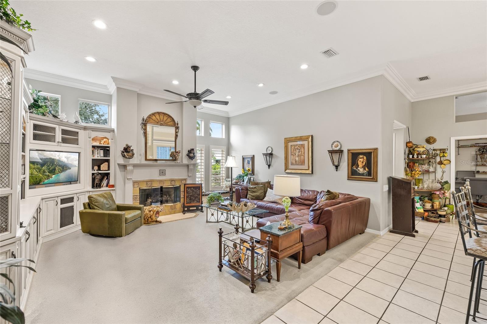 Flowing from the kitchen, the living room features custom built-ins and a gas fireplace.