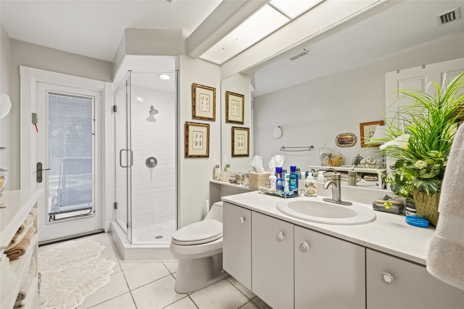 Pool bathroom with renovated shower.