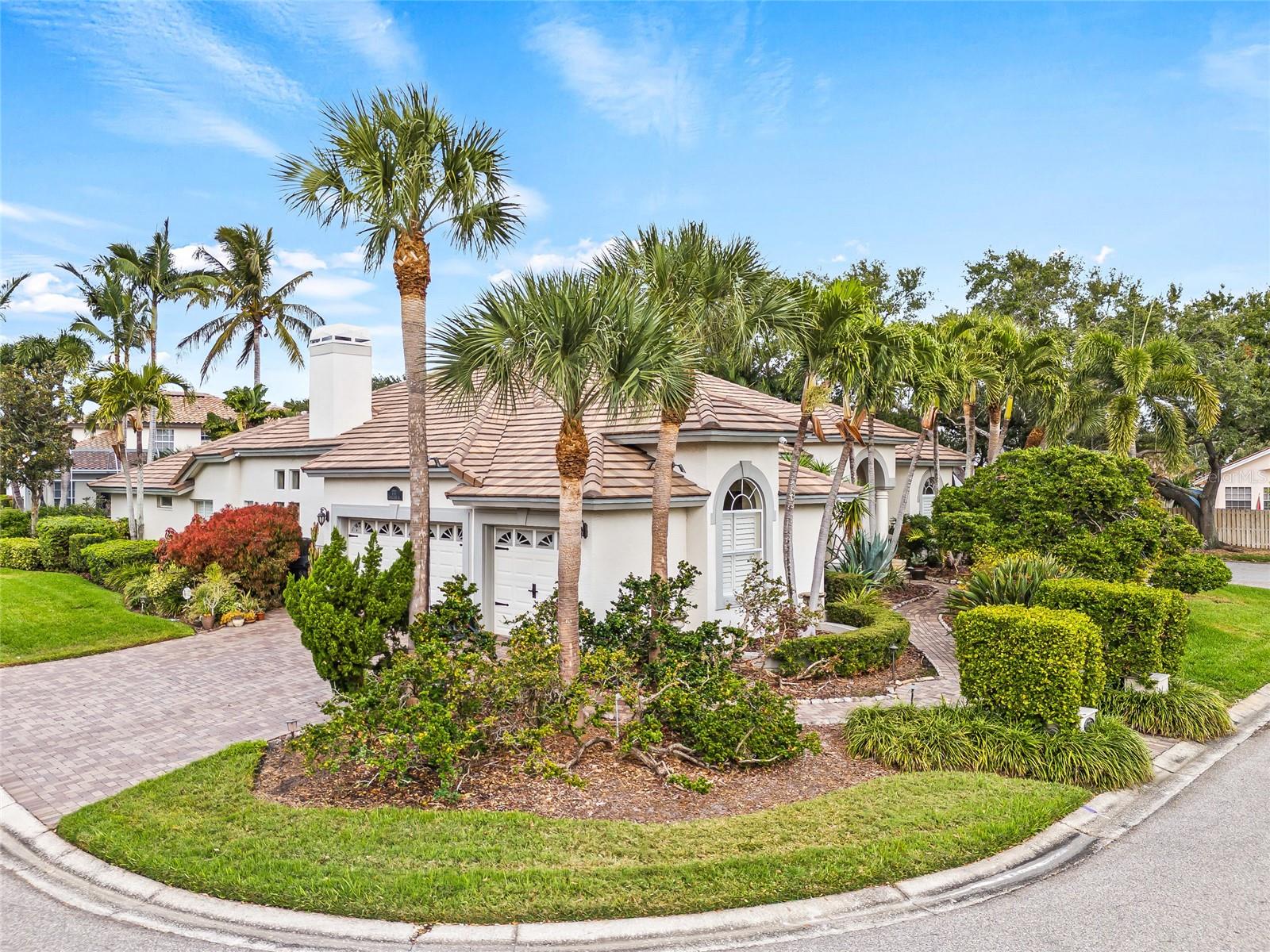 Front entrance is on the right side of the home with a beautiful paved path from the driveway.