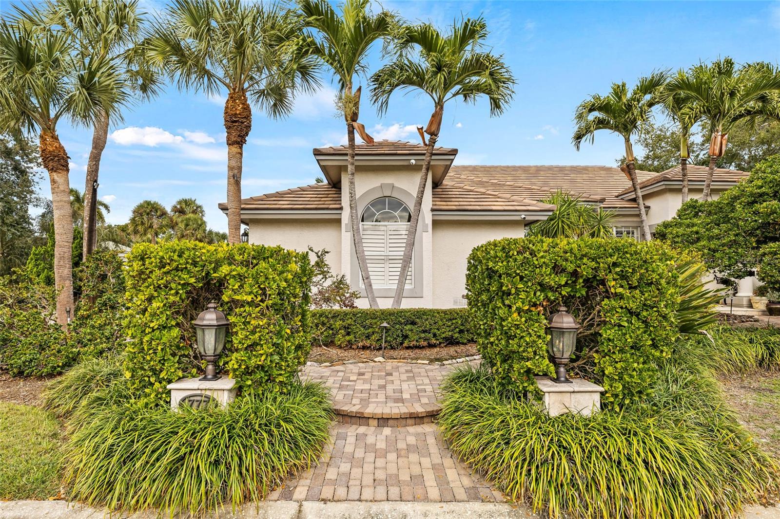 Custom landscaping creates a private and customized home in Placido Bayou.