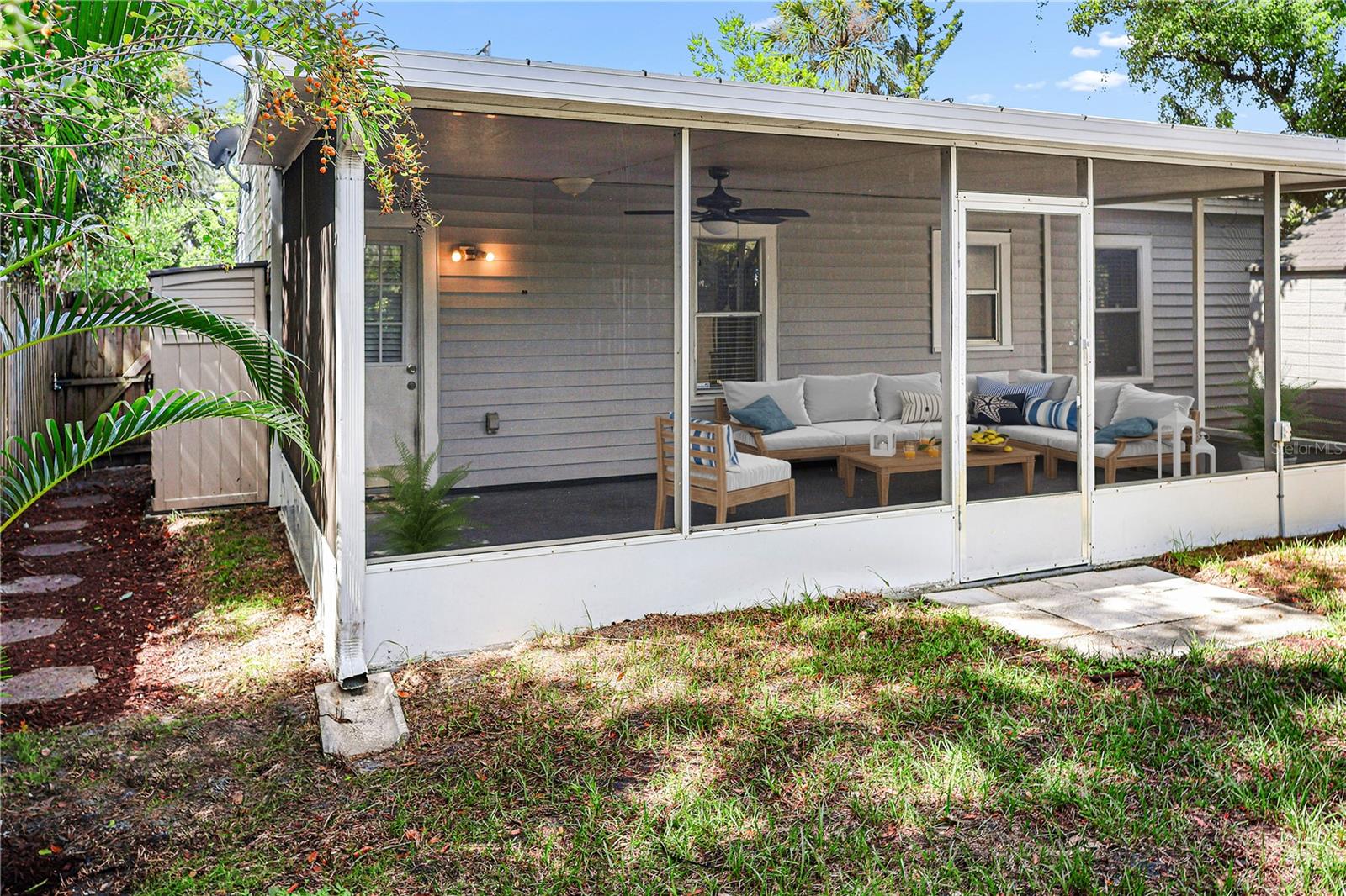 Perfect entertaining space with covered screened patio and backyard access.