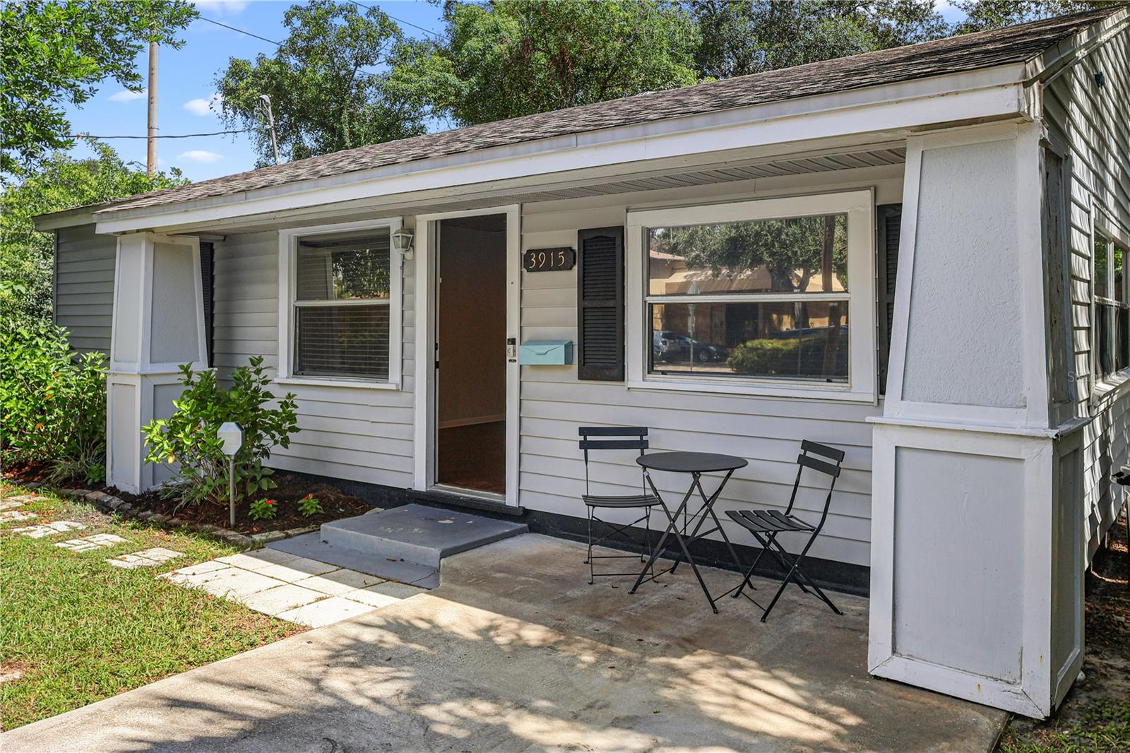 Picture yourself here: a sunny porch made for simple everyday moments.