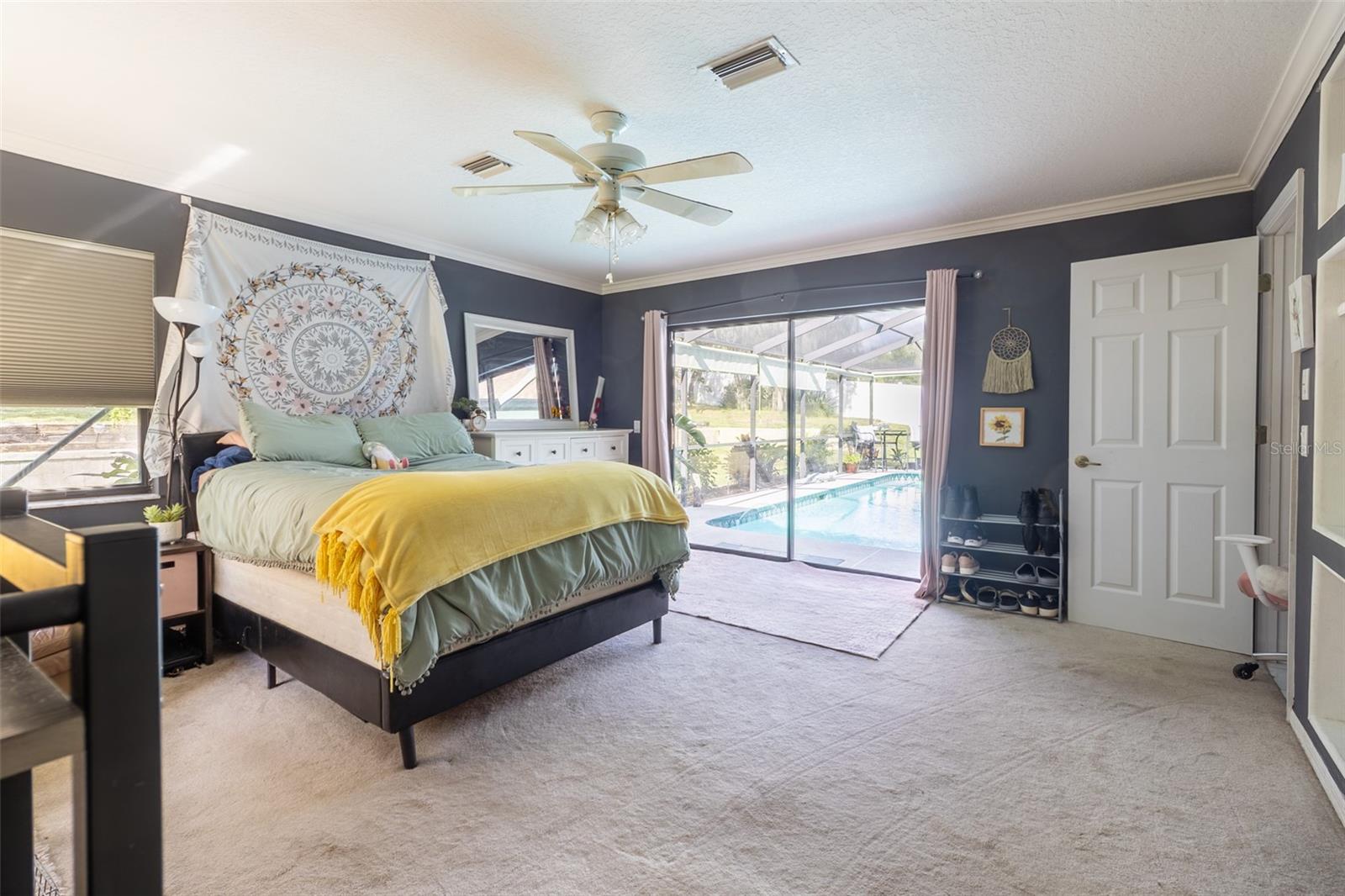 Bedroom w/ Sliding door to Pool