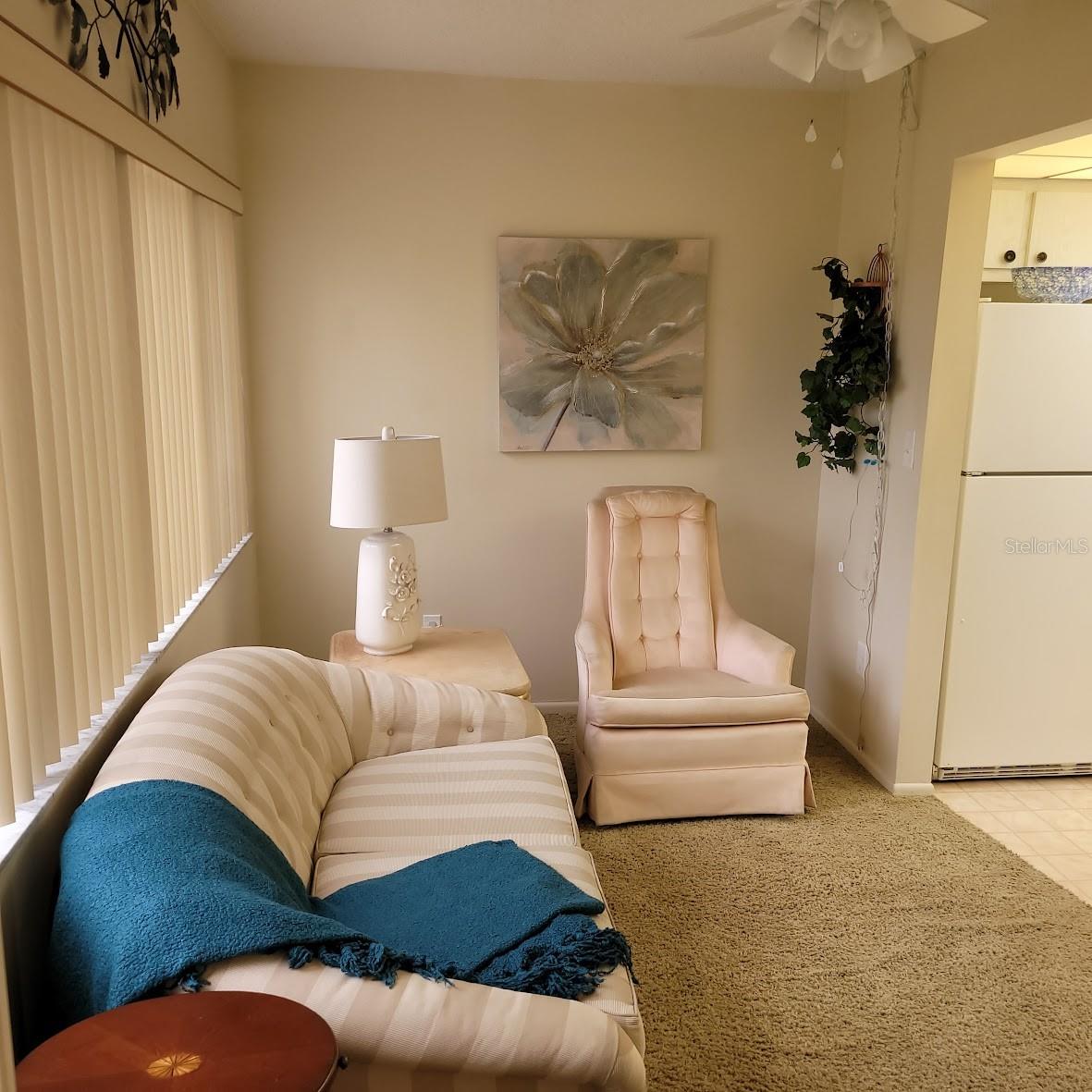 Leaving the Primary Bedroom, you will enter the small de_ Florida Room area. The space is ideal for relaxing with your favorite book or tv shows.  This is immediately off the kitchen.