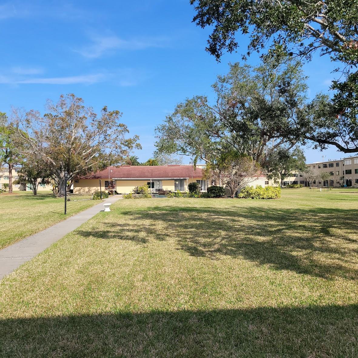 Leaving your unit, go through the side fence and take a walk to the Pool and clubhouse.