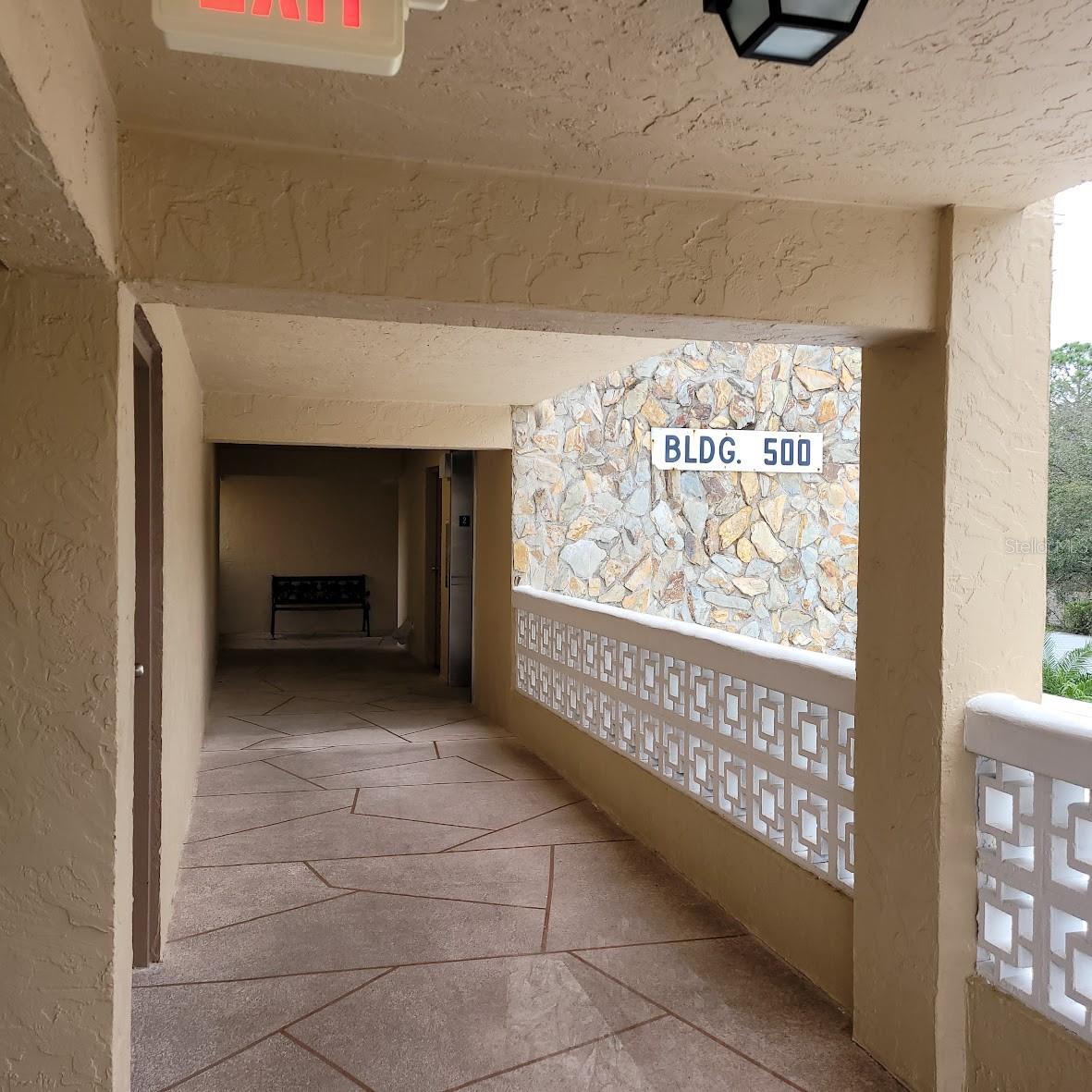 This hallway on the 2nd floor leads you to and from your condo to the laundry, trash, elevators, and stairs.