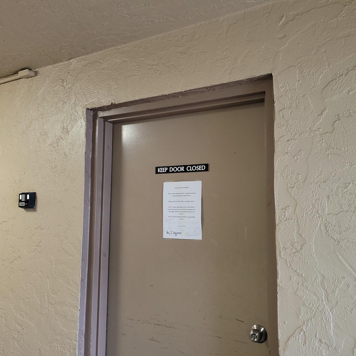 The door to the trashroom