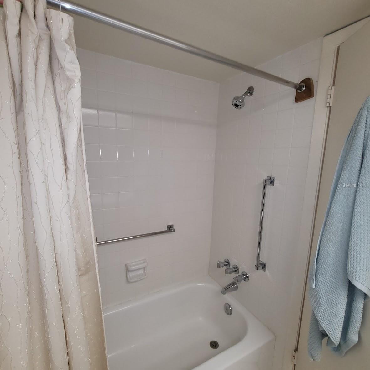 The guest bathroom has a tub.