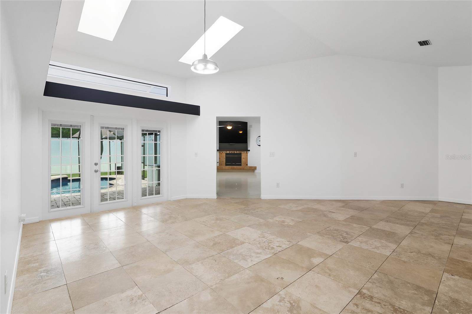 French doors overlooking the pool area