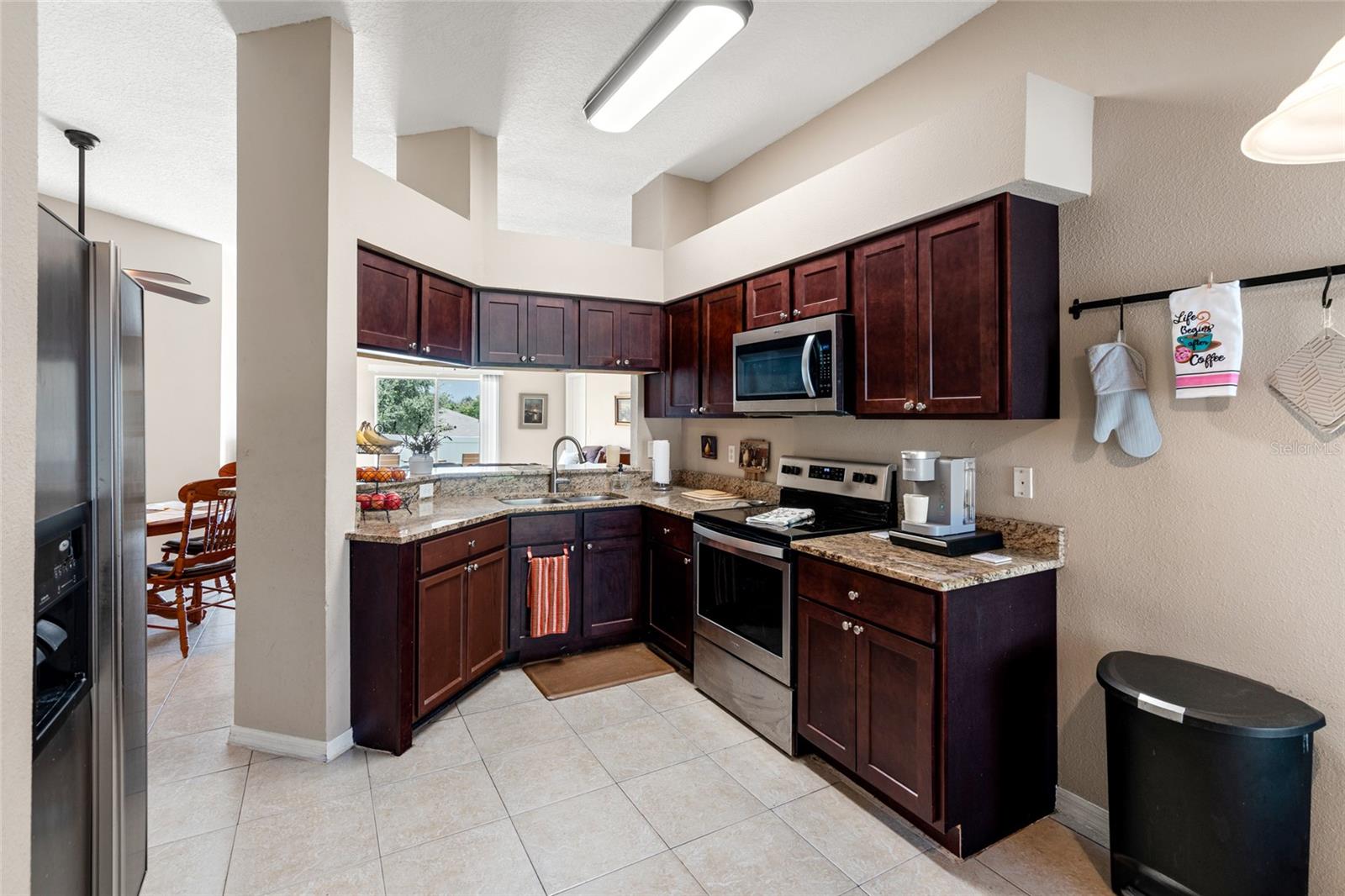 this kitchen has ample storage and a gorgeous view