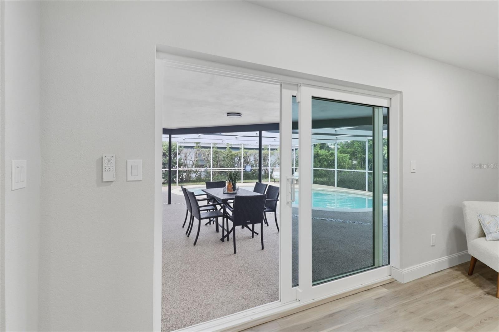 Impact Sliding Glass Doors Living Room to Pool