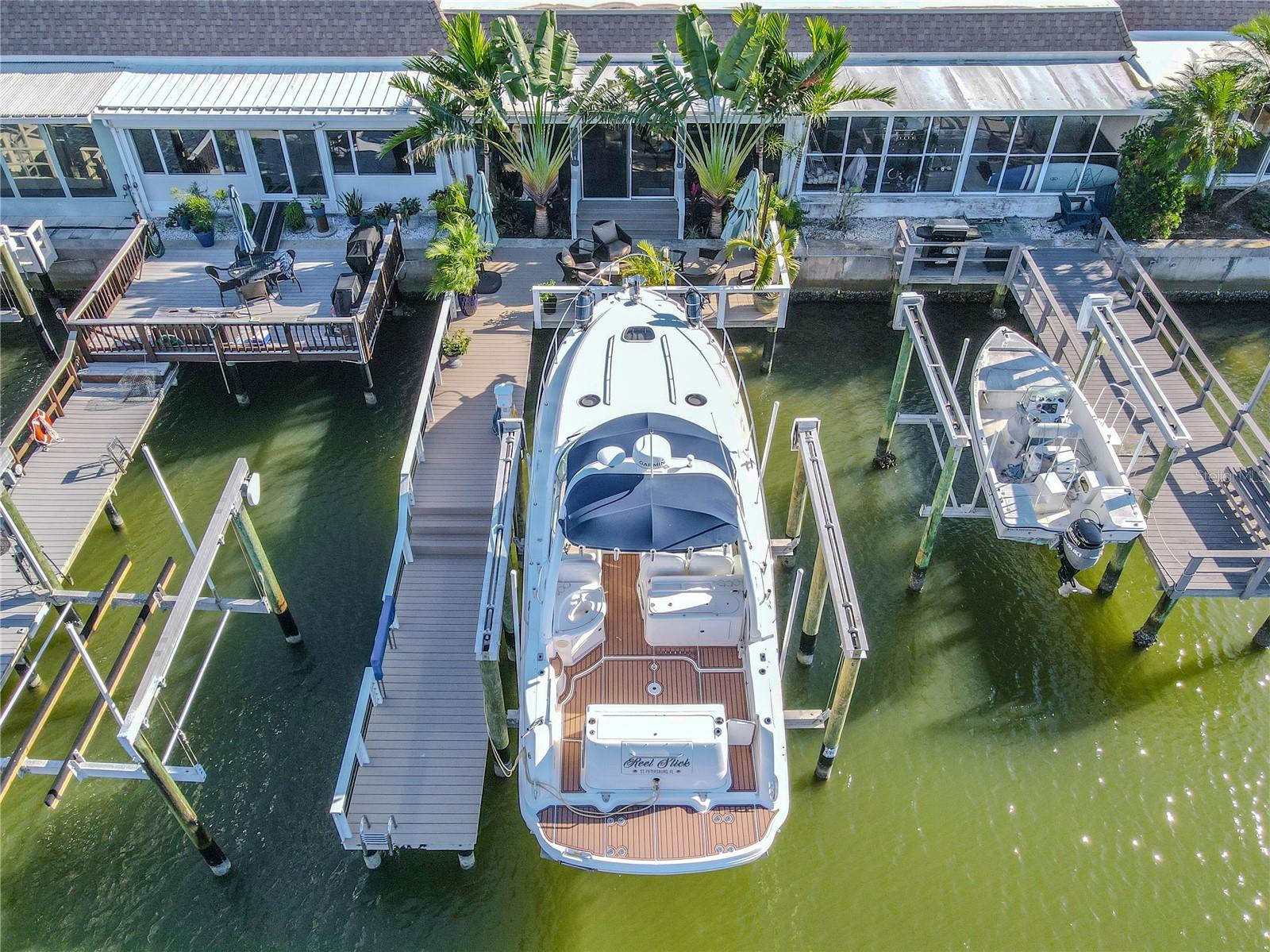 Your private dock includes a 16,000-lb oversized boat lift accommodating up to a 36-ft vessel, 50-amp shore power, and pedestal lighting for evening ambiance.