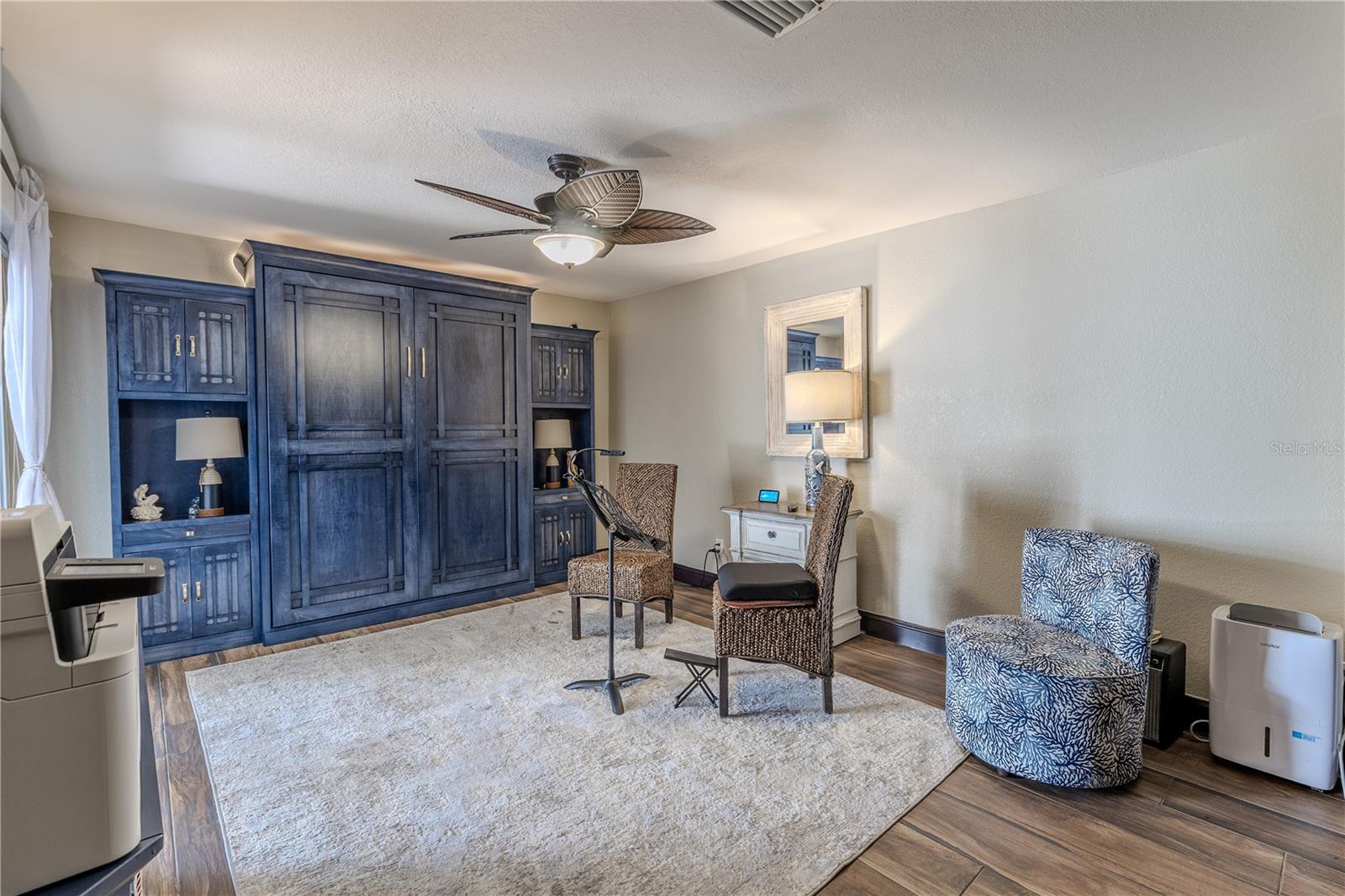 This spacious second bedroom includes both a walk-in and a standard closet, providing excellent storage and flexibility for guests or everyday use.