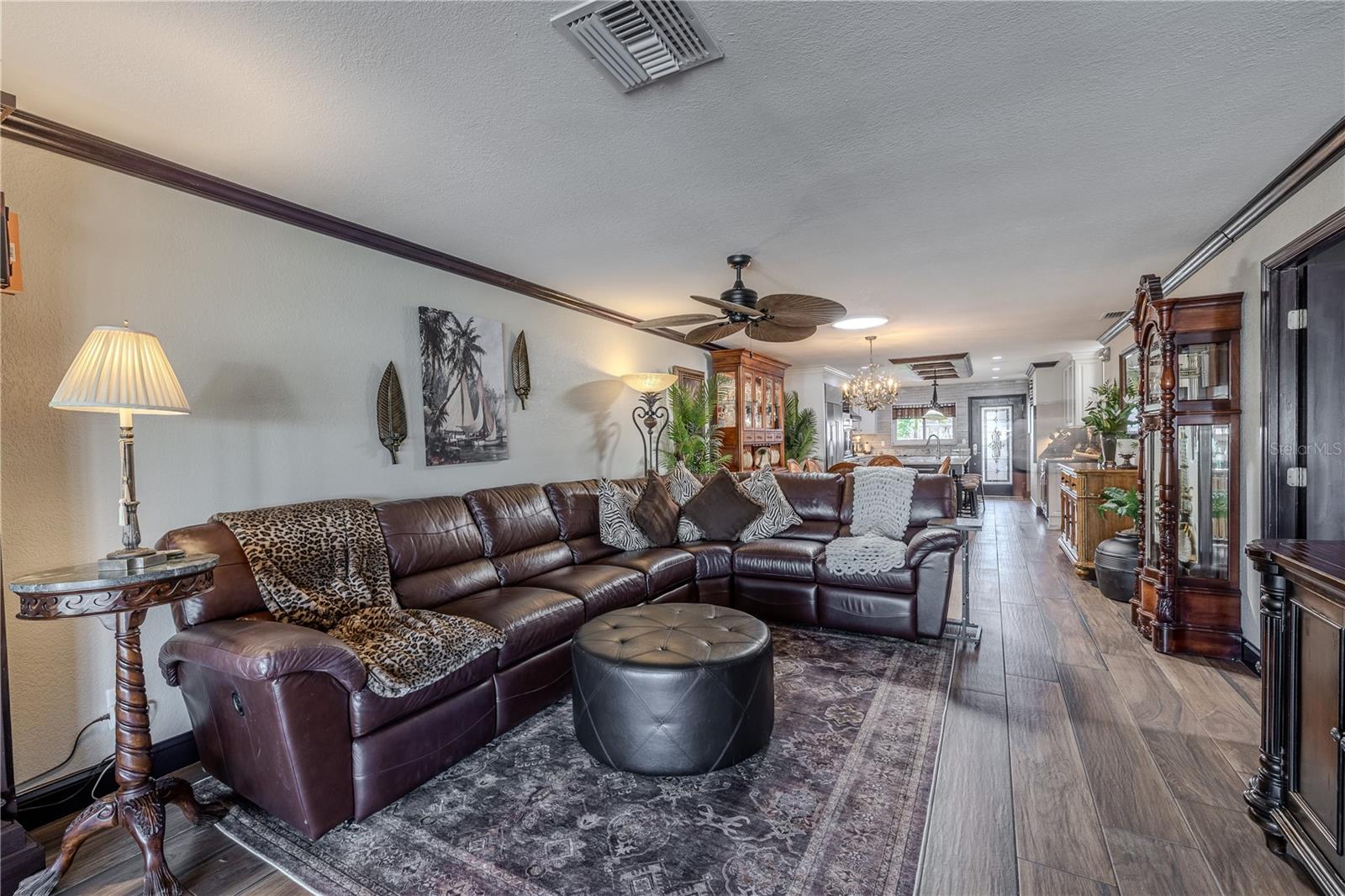 A warm and welcoming living area with timeless finishes, ceramic tile floors, and soft neutral tones that complement the home’s open design.