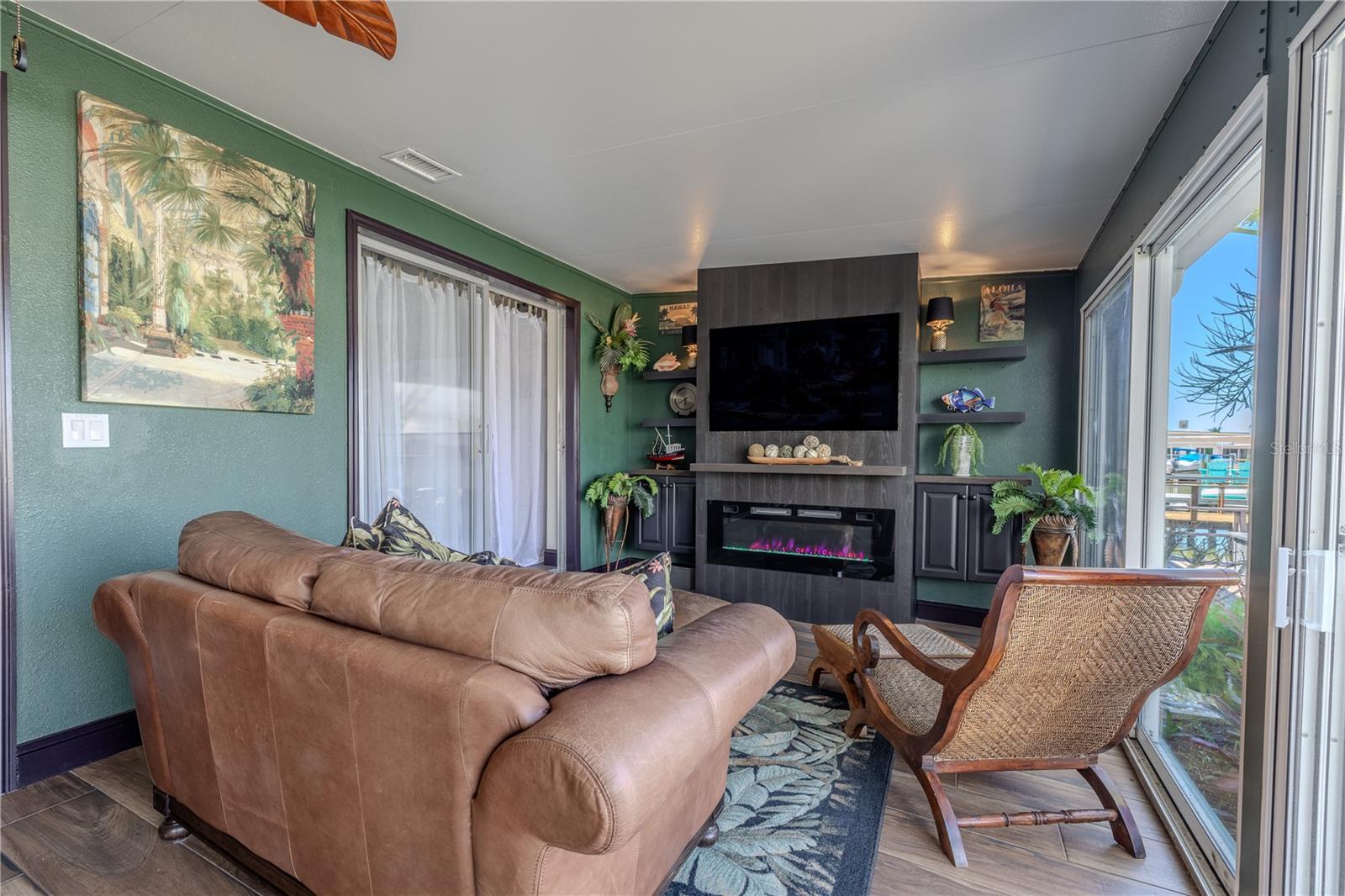 Relax in this inviting seating area surrounded by picture windows that fill the room with natural light and tranquil canal views.