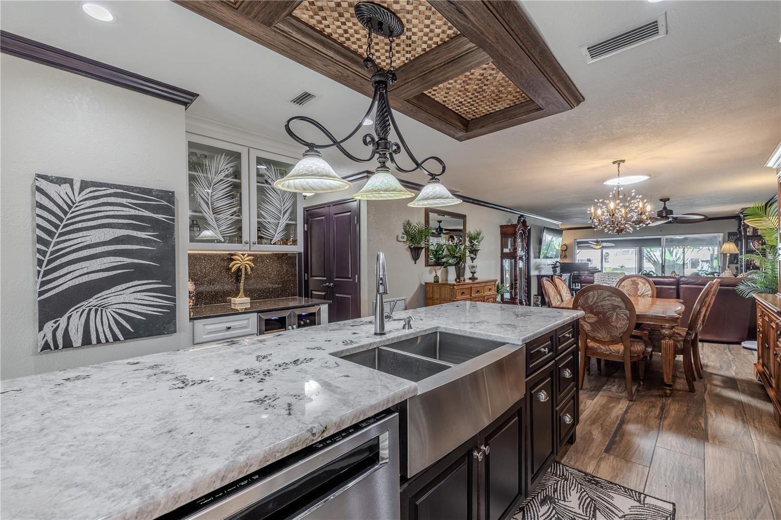 The dual-zone wine and beverage refrigerator provides the ultimate convenience for hosting, complementing the kitchen’s high-end finishes.