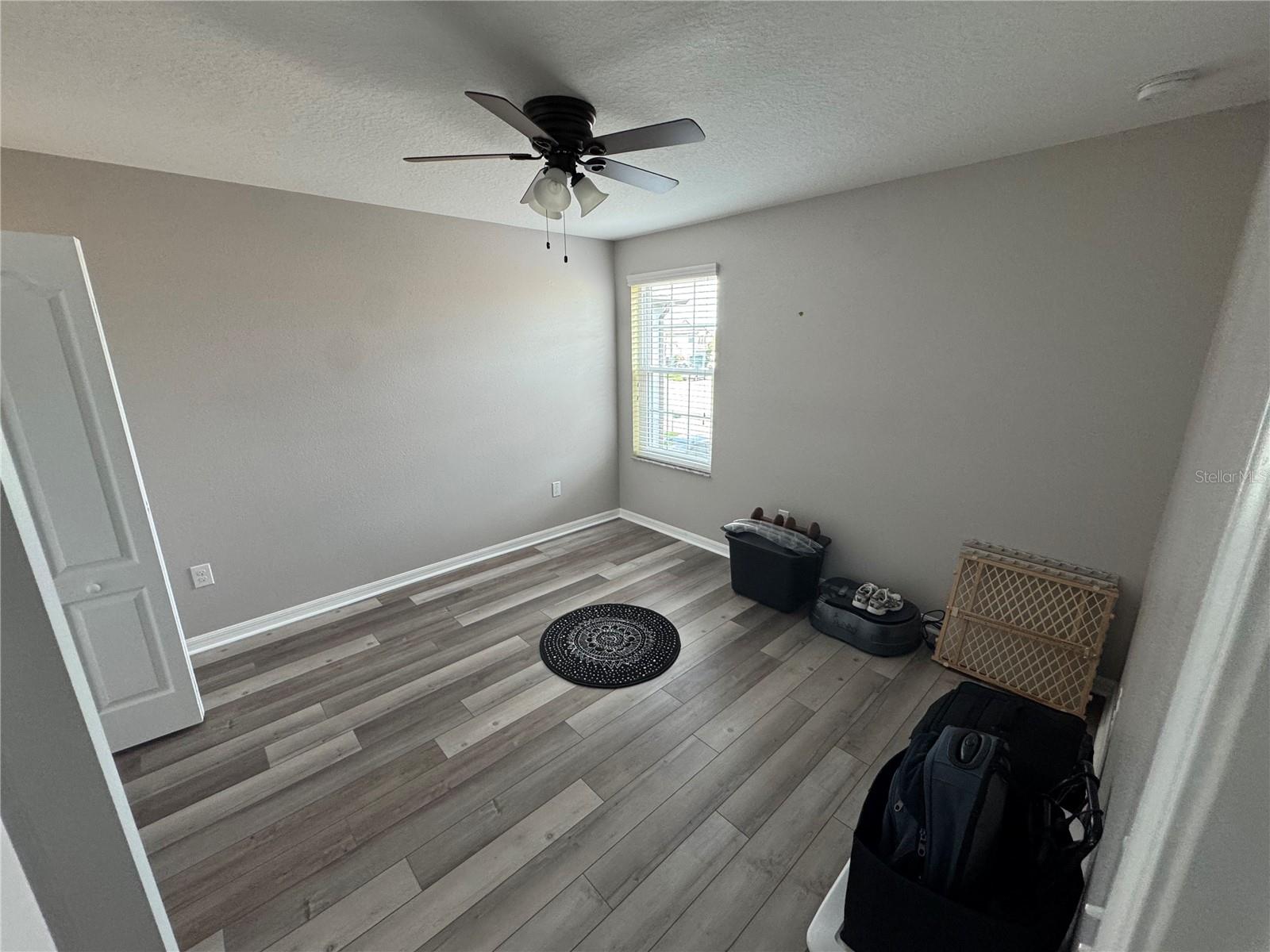Bedroom upstairs, seperate from three hallway bedrooms, overlooking front of the home.