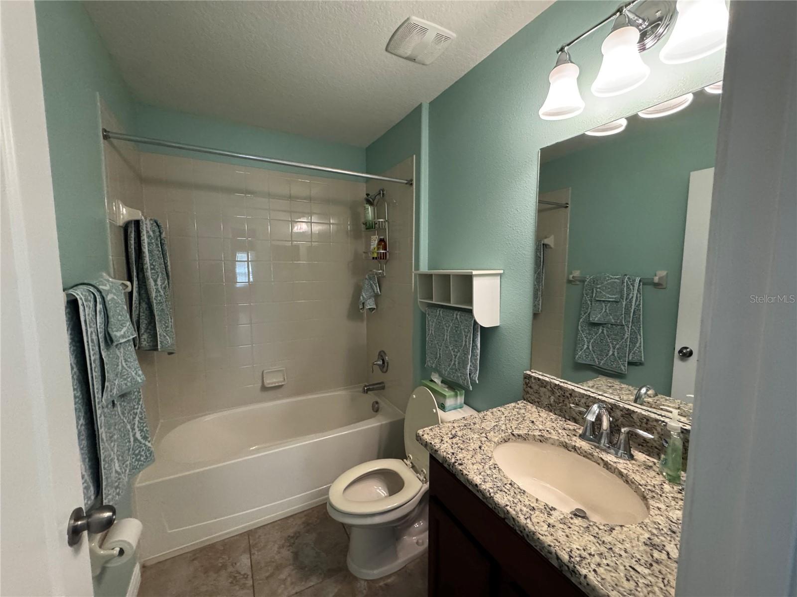 Bathroom directly off of the loft, next to bedroom overlooking front of the home.