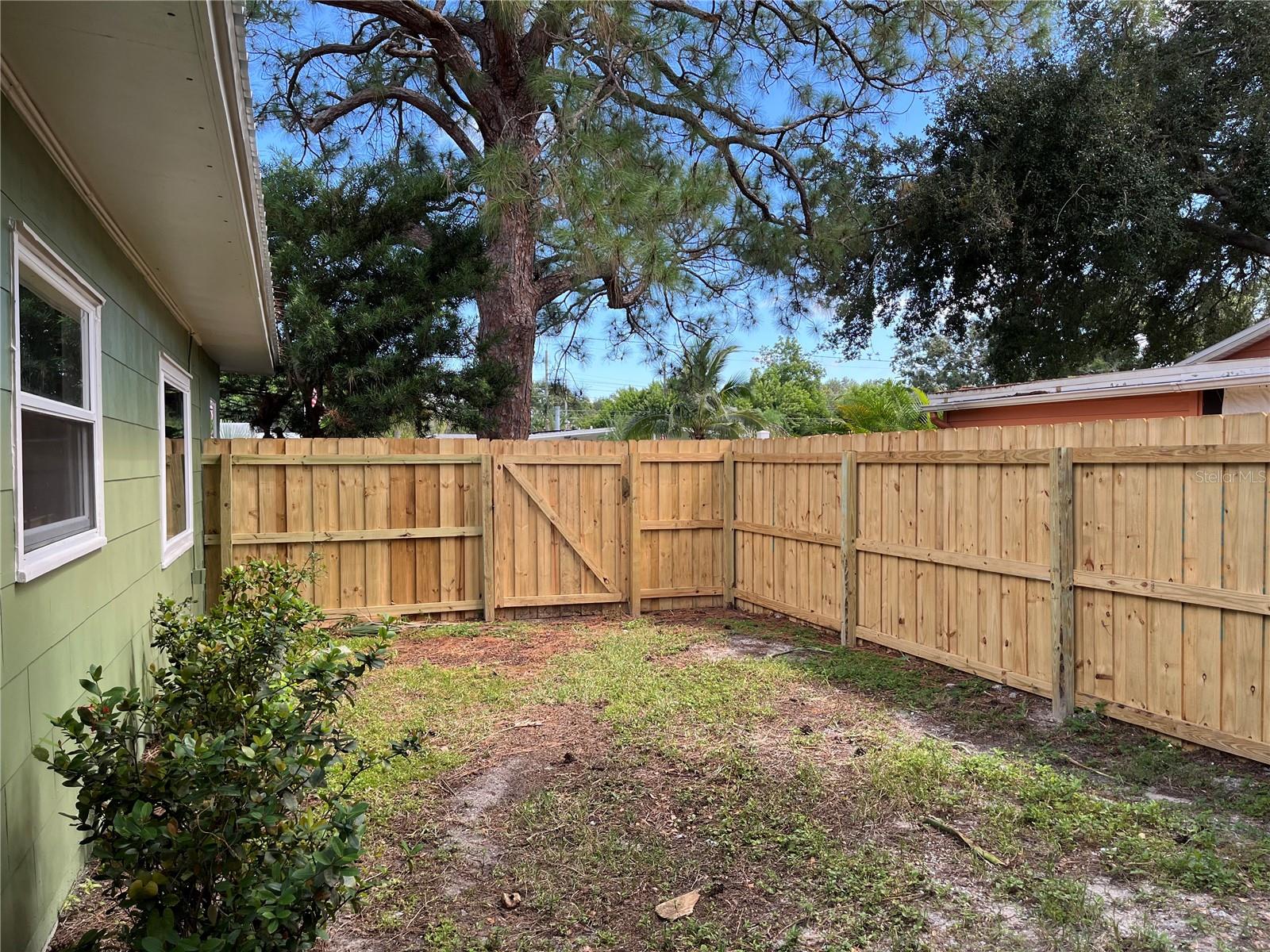FULLY FENCED YARD WITH ANOTHER GATE