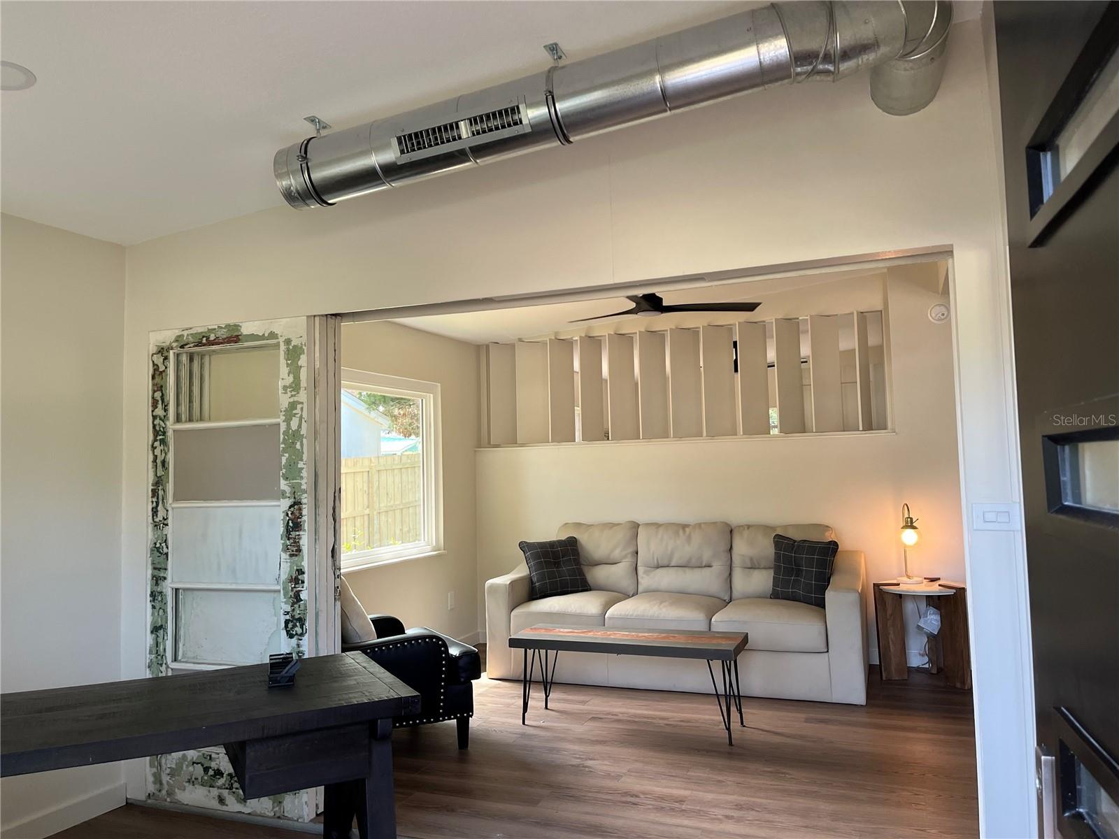 DOORWALL OPEN TO LIVING ROOM