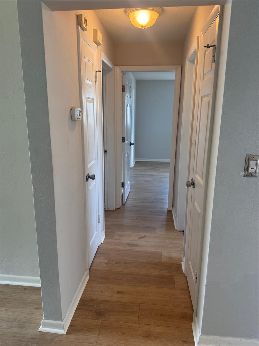 Hallway to 2 bedrooms and bath