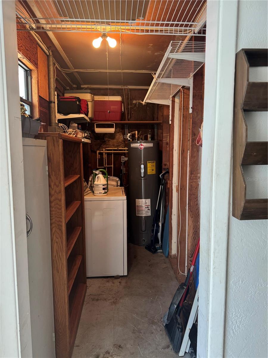 Enter from carport to the left is laundry room and hot water heater.