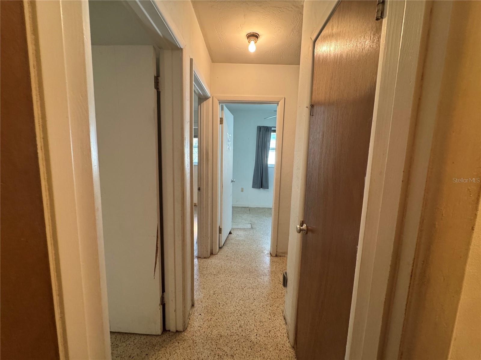 Hallway view from kitchen to the bedrooms.