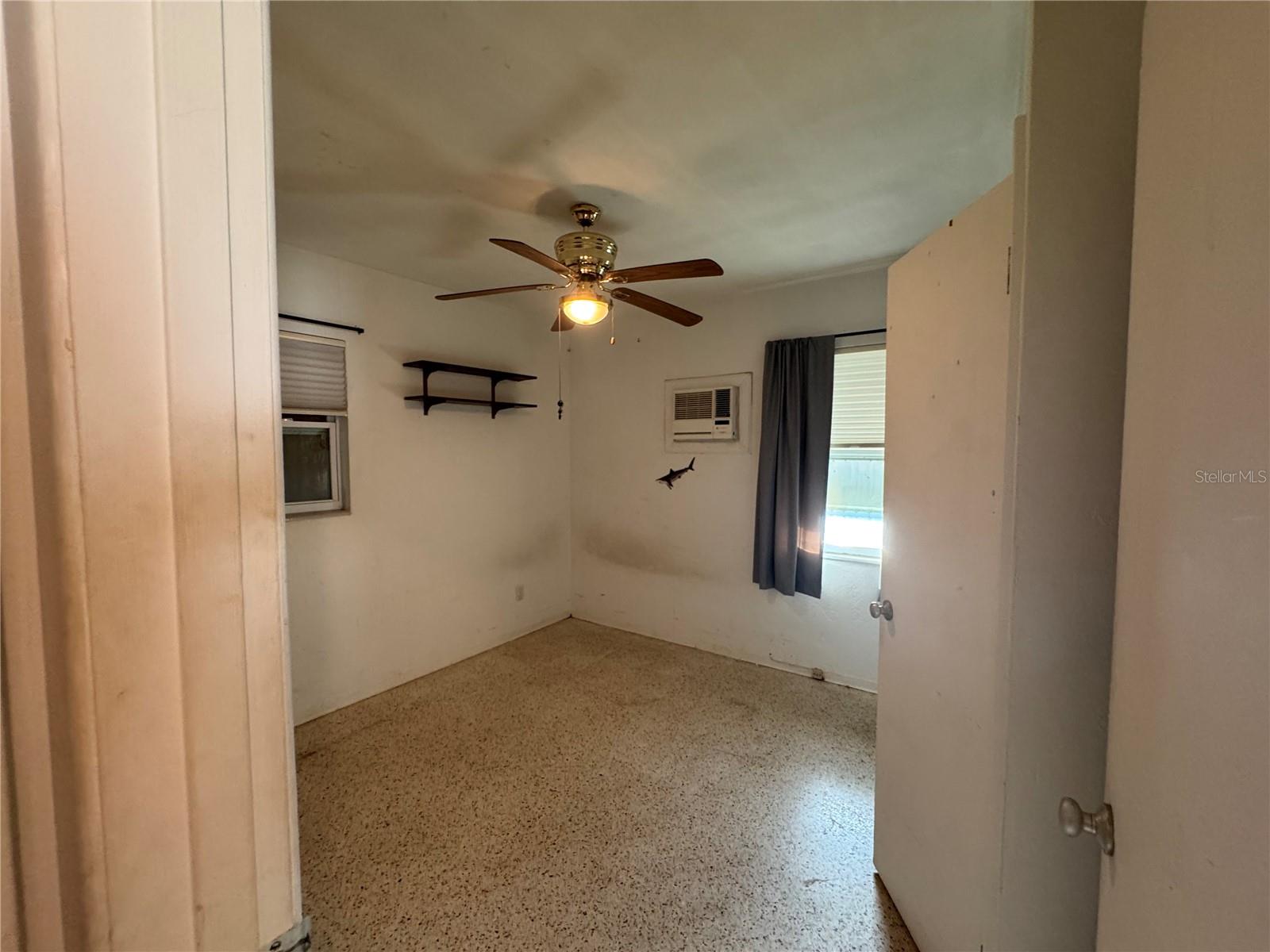 BR One facing backyard and window to carport on the side.